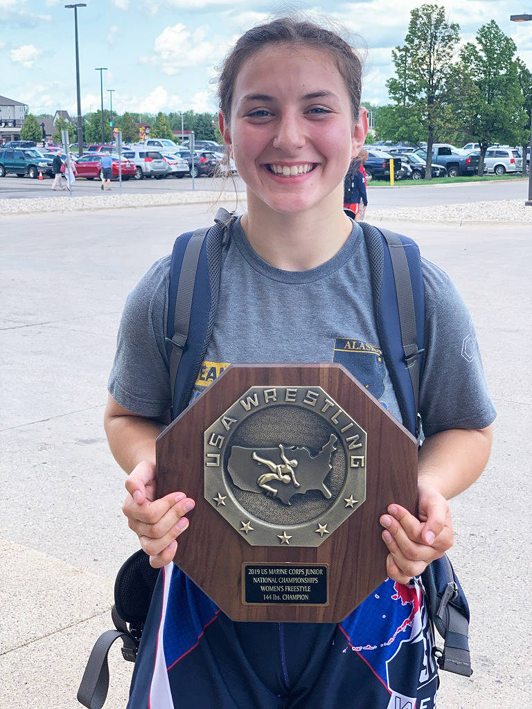Homer High School’s McKenzie Cook holds her first-place plaque after winning the 2019 U.S. Marine Corps Junior and 16U Nationals wrestling tournament for her weight class on Tuesday and Wednesday, July 16-17, 2019 in Fargo, North Dakota. (Photo by Tammie Cook)