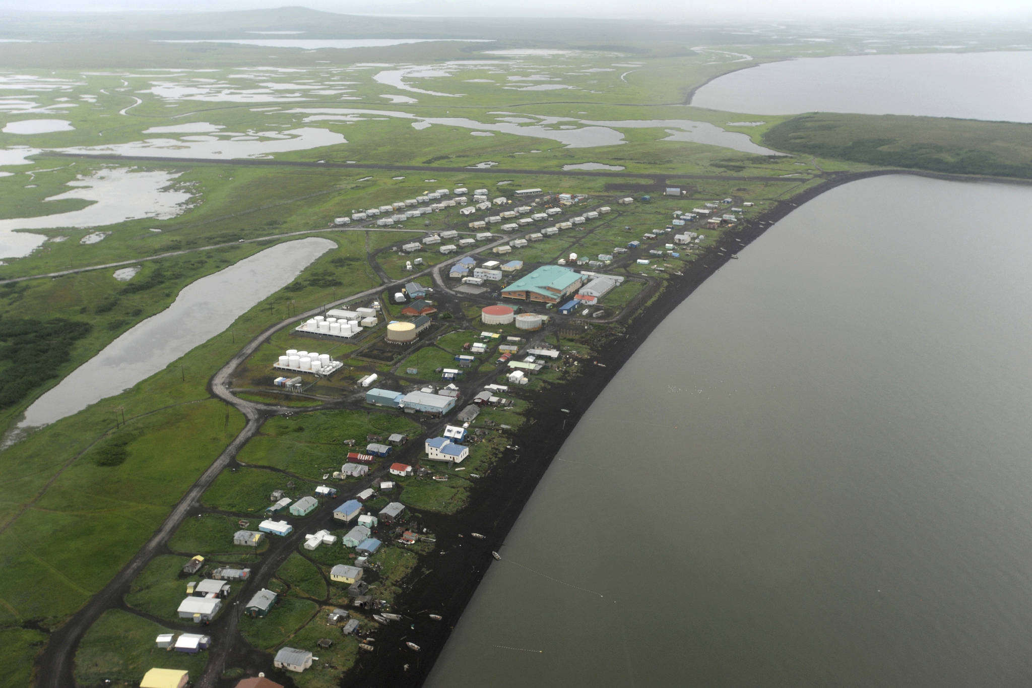 This Wednesday, June 26, 2019 photo shows an aerial view of the Yup’ik village of Stebbins on the Norton Sound coast in Western Alaska. The city is among over a dozen cities in Alaska that have employed police officers whose criminal records should have prevented them from being hired under state law, the Anchorage Daily News and ProPublica reported Saturday, July 20. (Bill Roth/Anchorage Daily News via AP)