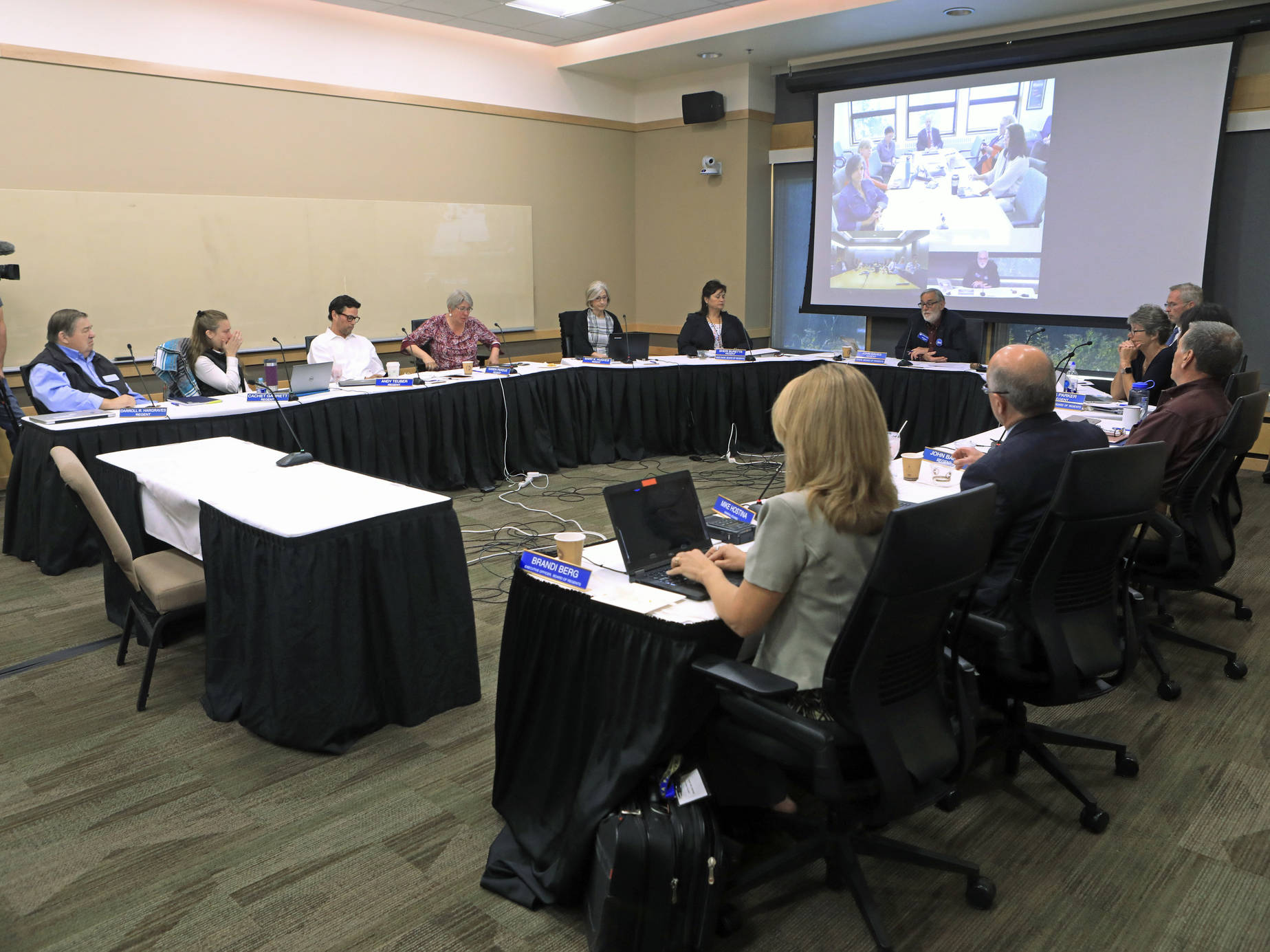 The University of Alaska Board of Regents meets in an emergency meeting in Anchorage, Alaska Monday, July 22, 2019. Regents voted 10-1 to declare a financial exigency, allowing administrators to expedite layoffs of tenured faculty in the face of severe budget issues. (AP Photo/Dan Joling)