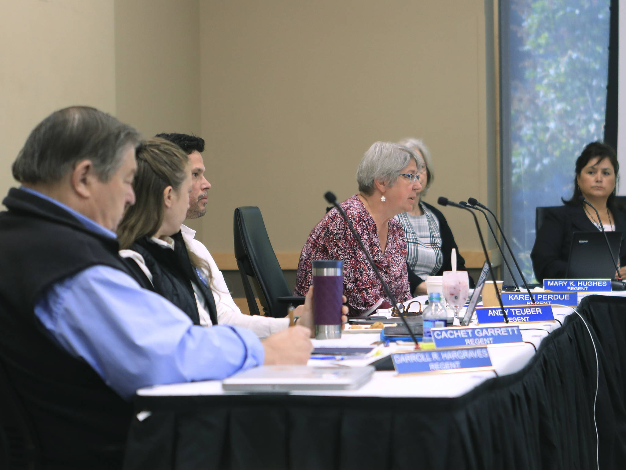 Dan Joling / Associated Press                                Regent Karen Perdue, center, speaks at an emergency meeting of the University of Alaska Board of Regents on July 22 in Anchorage. Regents voted 10-1 to declare a financial exigency, allowing administrators to expedite layoffs of tenured faculty in the face of severe budget issues.