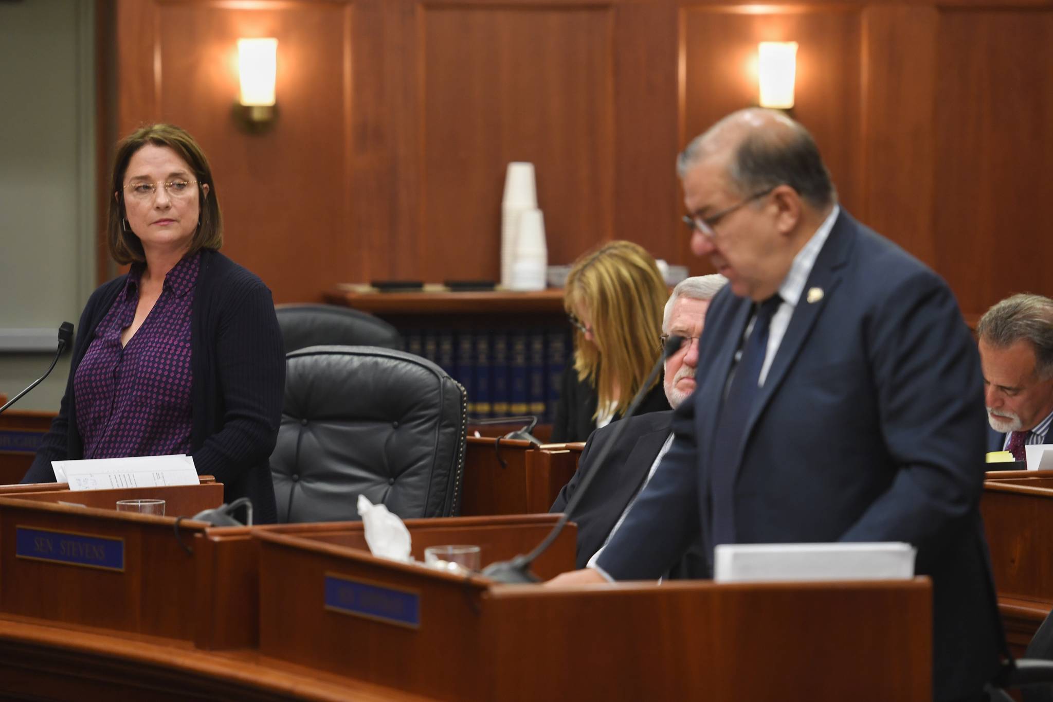 Sen. Lora Reinbold, R-Eagle River, watches as Senate Majority Leader Lyman Hoffman, R-Bethel, interrupts with a “point of order” during debate on the operating budget at the Capitol on Monday, July 29, 2019. (Michael Penn | Juneau Empire)