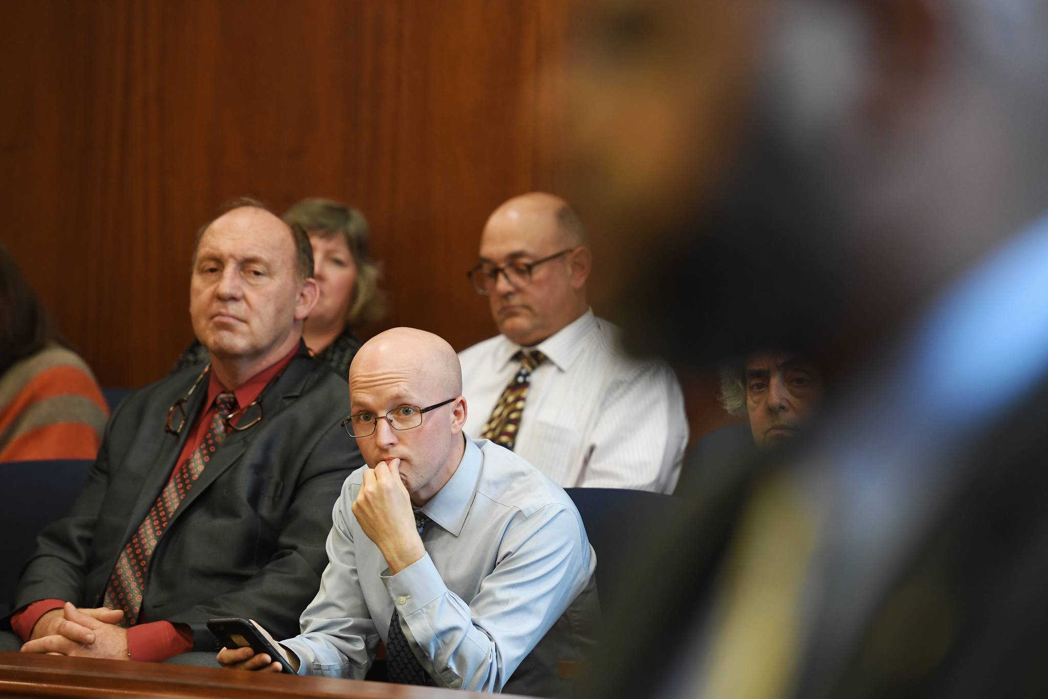 House member Rep. Gary Knopp, R-Kenai, left, Rep. Sara Hannan, D-Juneau, Rep. Jonathan Kreiss-Tomkins, D-Sitka, and Rep. Andy Josephson, D-Anchorage, listen to Sen. David Wilson, R-Wasilla, from the Senate gallery as Wilson speaks on the the operating budget at the Capitol on Monday, July 29, 2019 (Michael Penn | Juneau Empire)