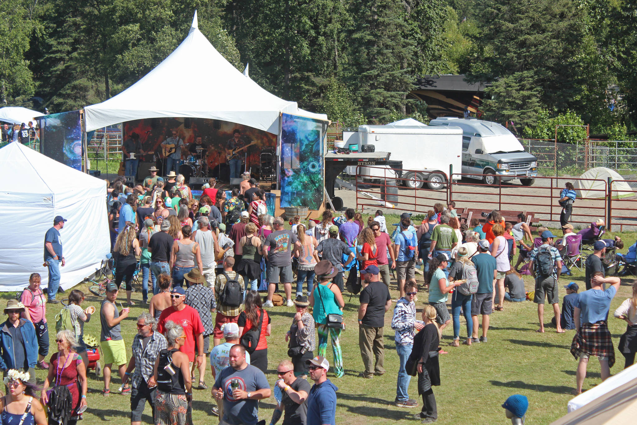 Festival goers listen to a performance at the River Stage on Saturday, Aug. 3, 2019 at Salmonfest in Ninilchik, Alaska. (Photo by Megan Pacer/Homer News)