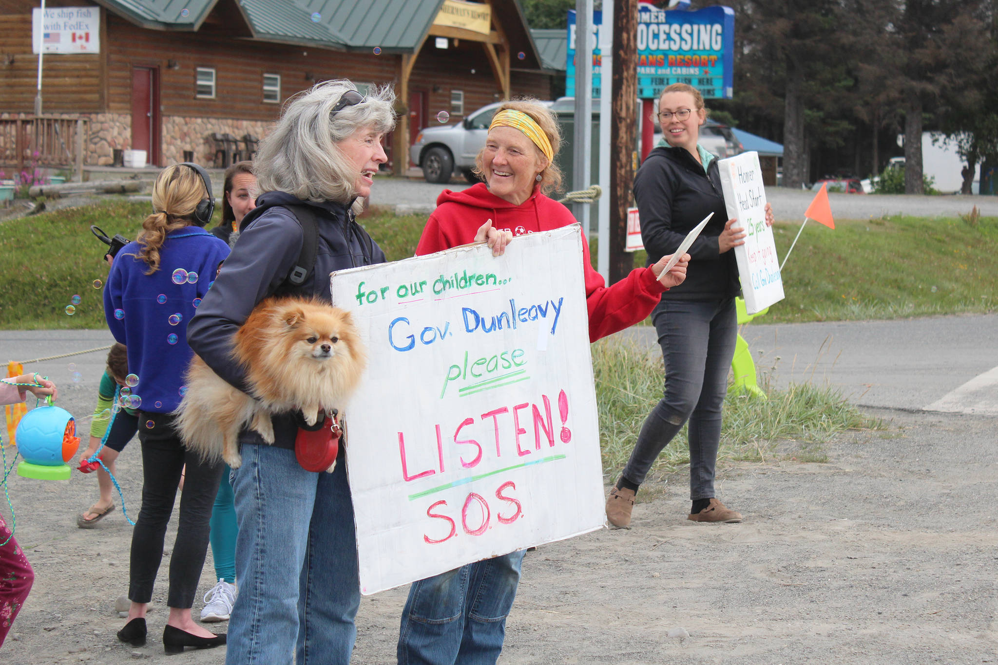 Staff and community members hold a demonstration Thursday, Aug. 1, 2019 outside the Homer Head Start building on Ocean Drive in Homer, Alaska, to protest the veto by Gov. Mike Dunleavy of state funding for head start programs. The Homer location is in danger of being shut down if the vetoes go through. (Photo by Megan Pacer/Homer News)