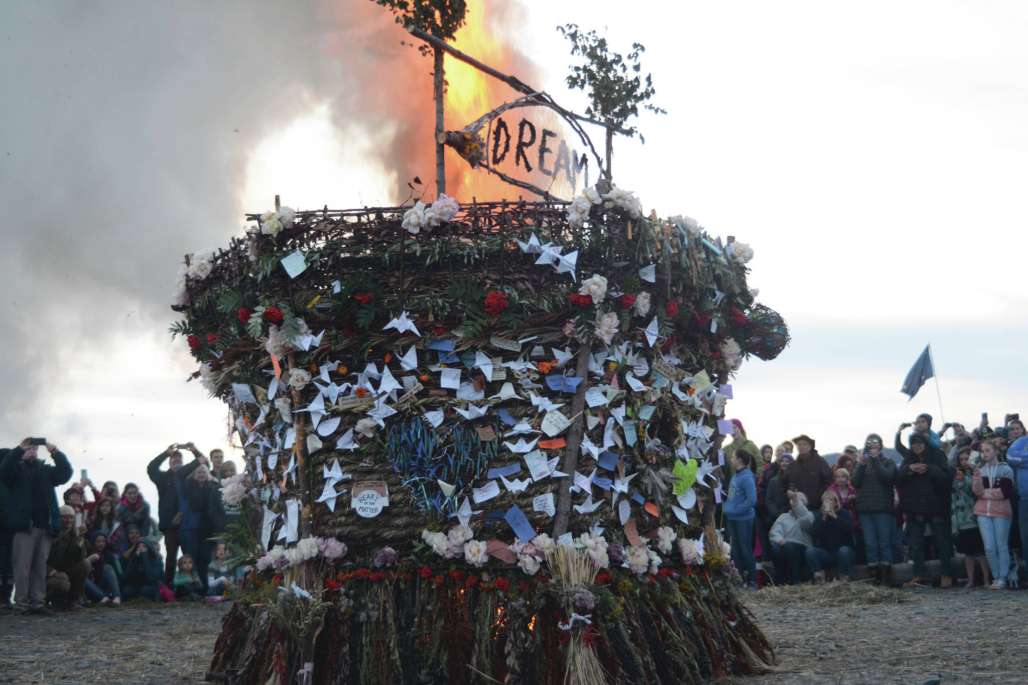 The 2018 Burning Basket, Dream, catches fire on Sept. 9, 2018, at Mariner Park in Homer, Alaska. (Photo by Michael Armstrong/Homer News)