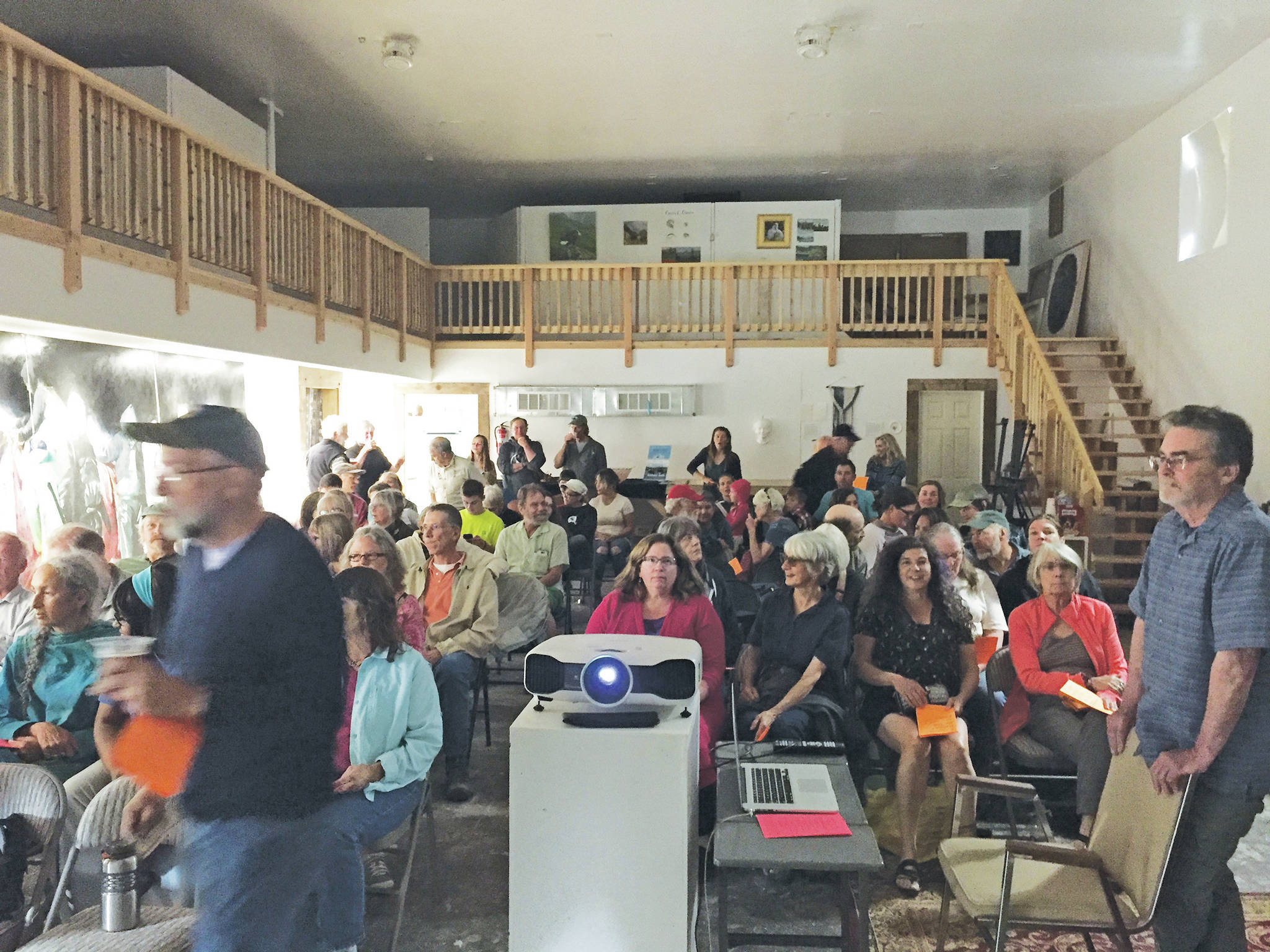 The audience waits for the start of a PechaKucha 20x20 presentation on July 25, 2019, at The Shop in Kachemak City, Alaska. (Photo by Brianna Allen)