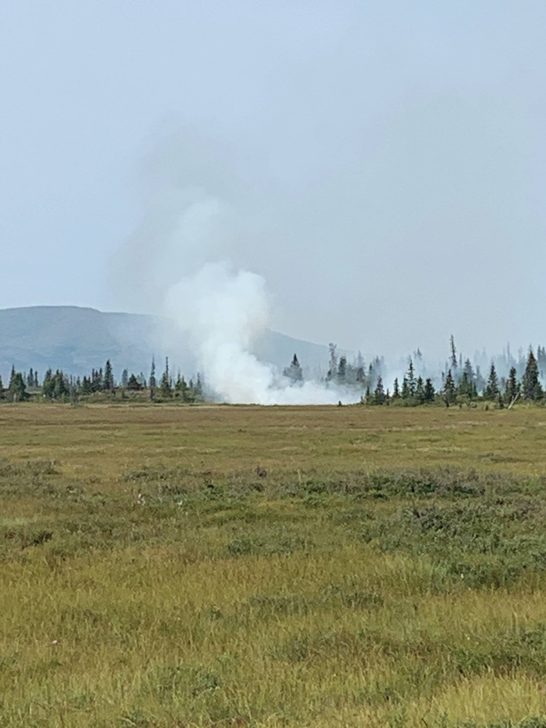 This photo of the Caribou Lake fire was taken about 2:30 p.m. Monday, Aug. 19, 2019, northeast of Homer, Alaska, whenr Ian Pitzman texted a message reporting the fire to his wife, Stephanie Pitzman, via an inReach satellite communication device. (Photo by Ian Pitzman)