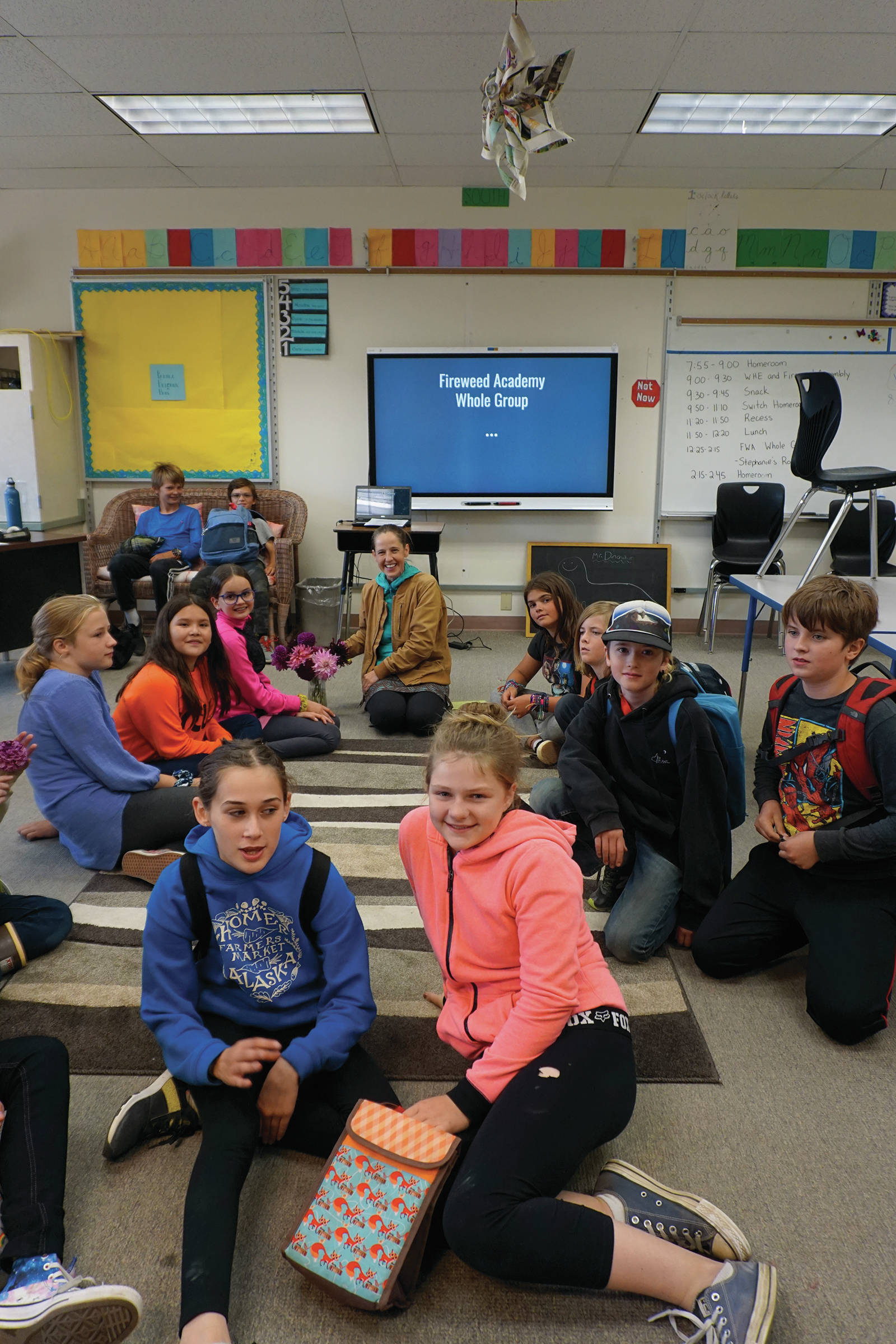Fireweeed Academy teacher Diane Ditton and her fifth- and sixth-grade students pose for a photo at the end of the first day of school on Tuesday, Aug. 20, 2019, in Homer, Alaska. (Photo by Michael Armstrong/Homer News)