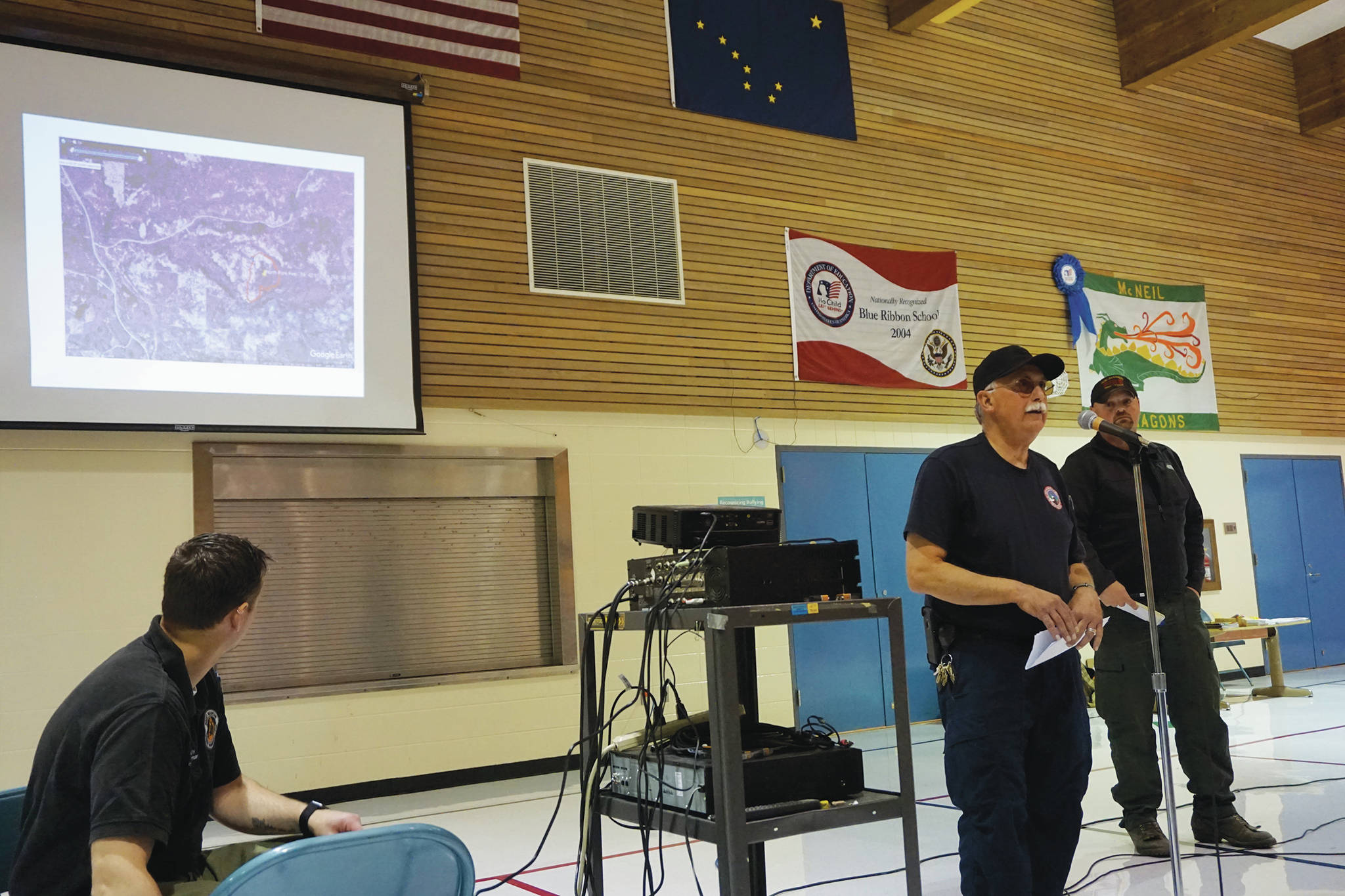Kachemak Emergency Services Chief Bob Cicciarella provides an update on the North Fork and Caribou Lake fires on Saturday, Aug. 24, 2019, at a community meeting at McNeil Canyon Elementary School near Fritz Creek, Alaska. (Photo by Michael Armstrong/Homer News)