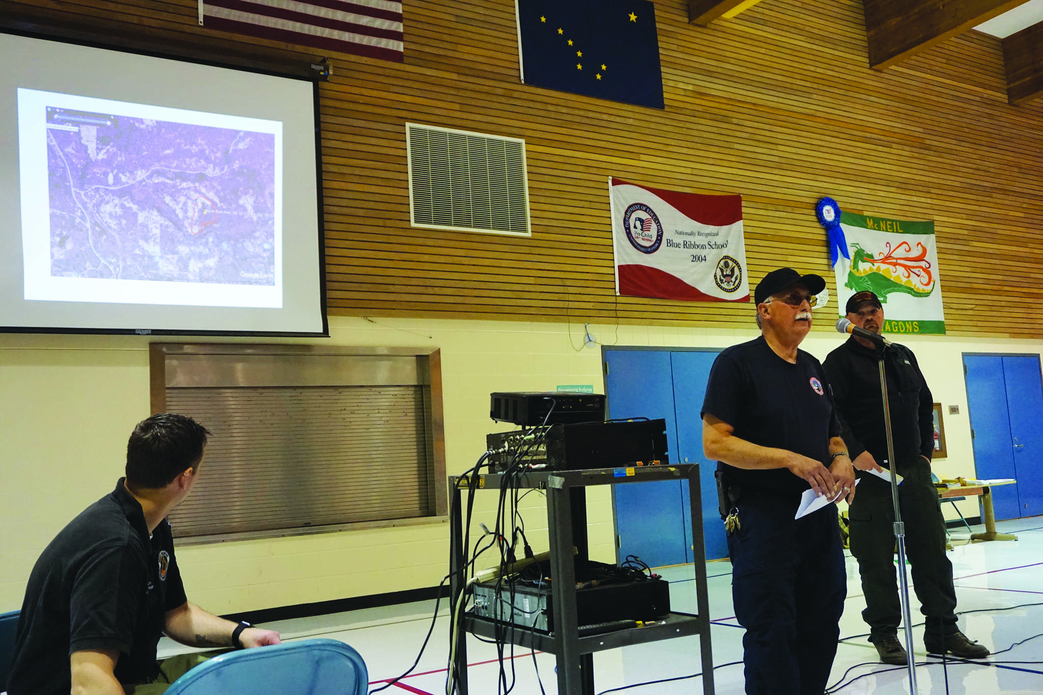 Kachemak Emergency Services Chief Bob Cicciarella provides an update on the North Fork and Caribou Lake fires on Saturday, Aug. 24, 2019, at a community meeting at McNeil Canyon Elementary School near Fritz Creek, Alaska. (Photo by Michael Armstrong/Homer News)