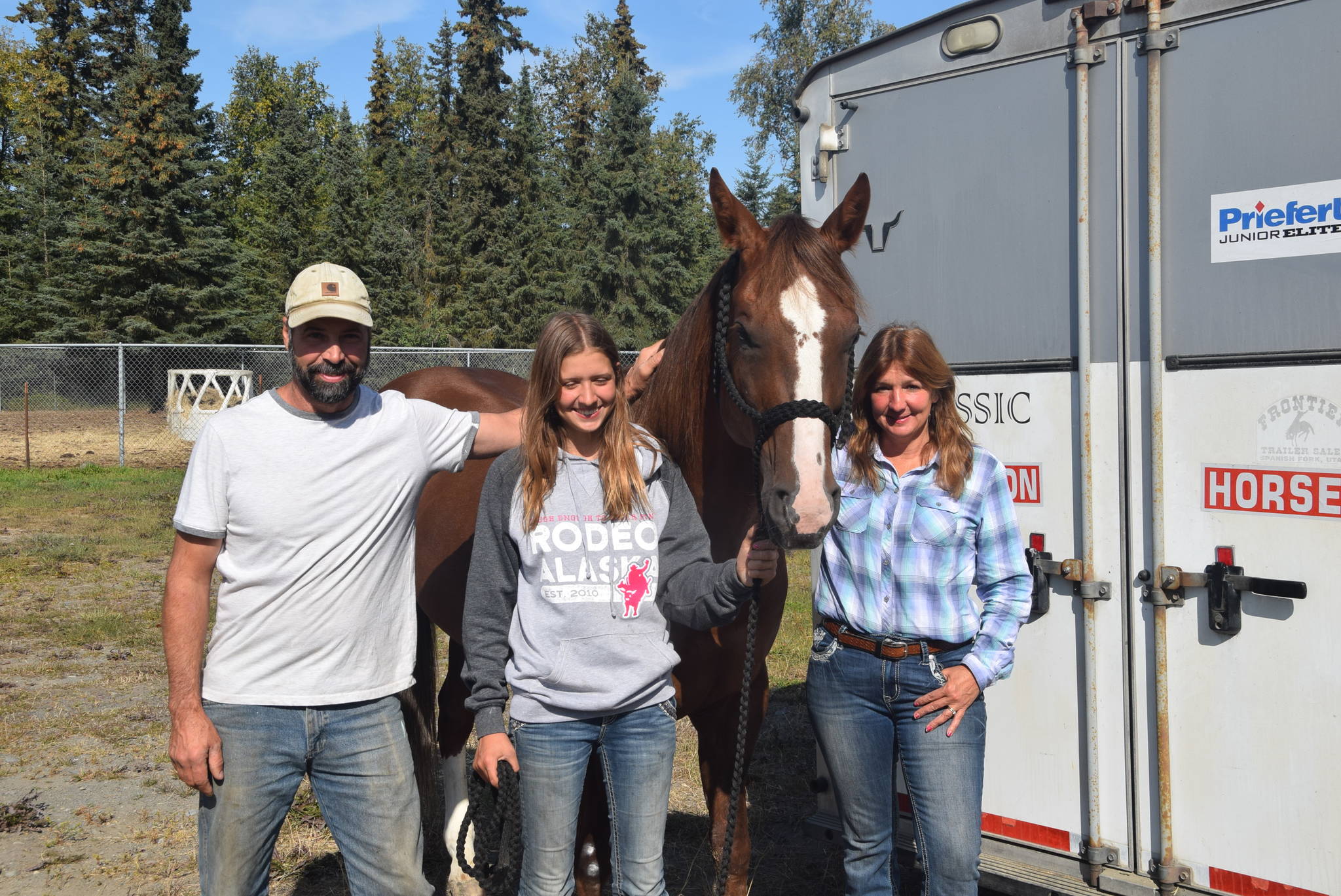Brian Mazurek/Peninsula Clarion                                From left, Mike, Laura and Robin Haight stand with their horse at the Soldotna Rodeo Grounds in Soldotna on Tuesday. The family has been keeping its two horses at the rodeo grounds since last week. The family had to leave them in Soldotna while they drove up to Palmer for the Alaska State Fair.