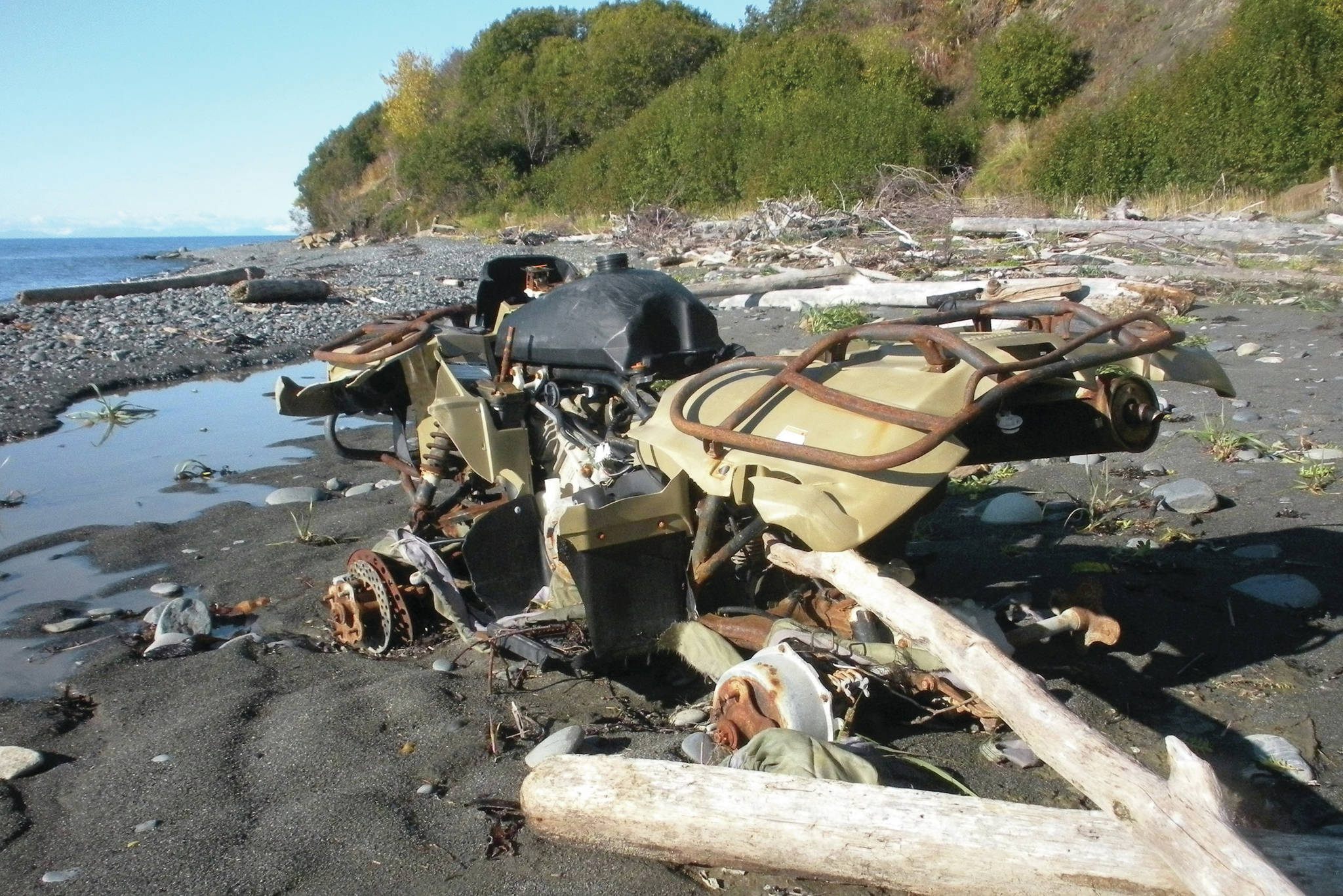 An abandoned Yamaha ATV sits on the Diamond Creek beach on Oct. 9, 2011, near Homer, Alaska. CoastWalk volunteers document beach trash such as this — and try to collect it. (Homer News file photo)