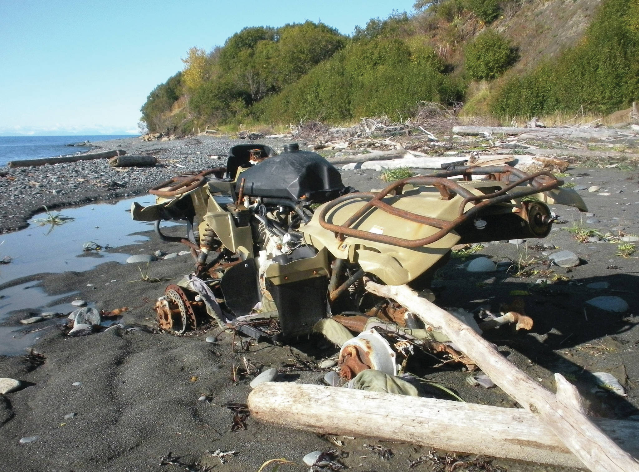 An abandoned Yamaha ATV sits on the Diamond Creek beach on Oct. 9, 2011, near Homer, Alaska. CoastWalk volunteers document beach trash such as this — and try to collect it. (Homer News file photo)