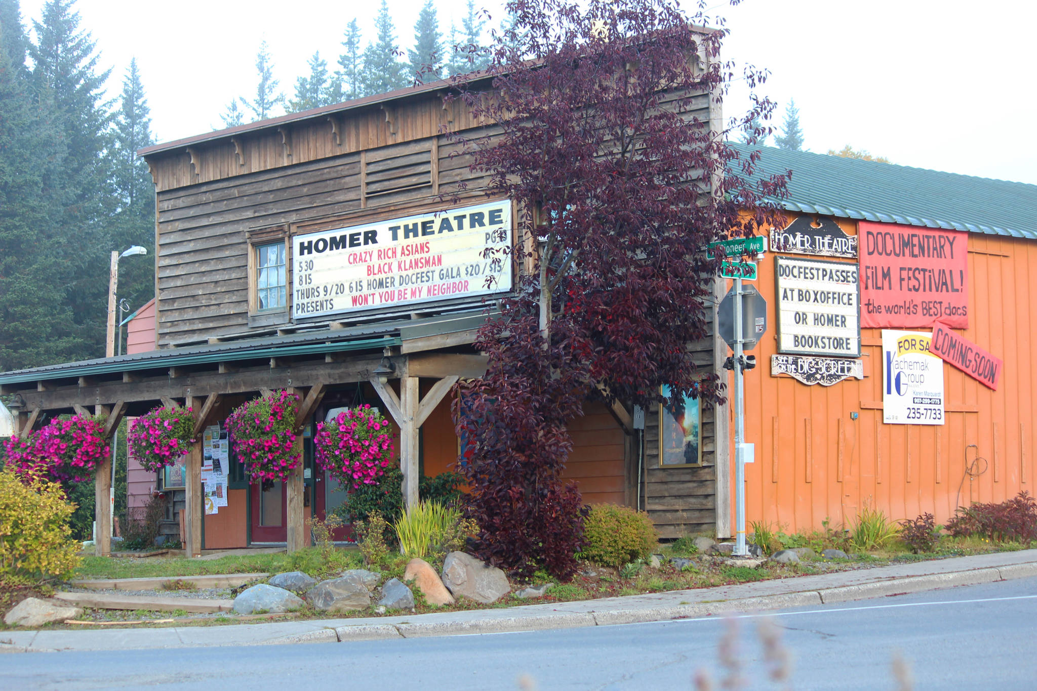A sign advertising the annual Homer Documentary Film Festival hangs on the side of the Homer Theatre Wednesday, Sept. 19, 2018 in Homer, Alaska. (Photo by Megan Pacer/Homer News)