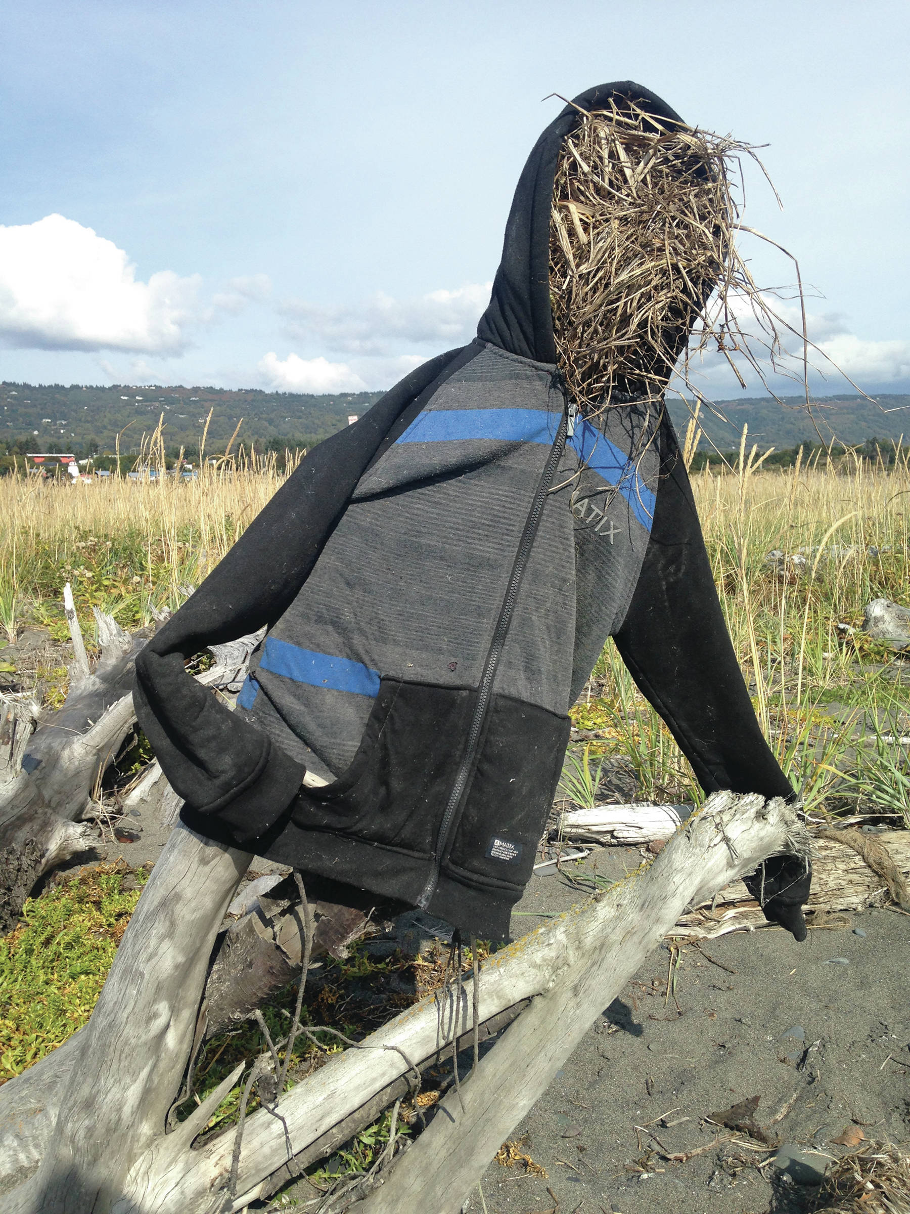 Straw man Someone stuffed with grass a coat that washed up on the Homer Spit beach on Thursday, Sept. 5, 2019, in Homer, Alaska. No crows were observed in the vicinity of the impromptu art. (Photo by Michael Armstrong/Homer News)