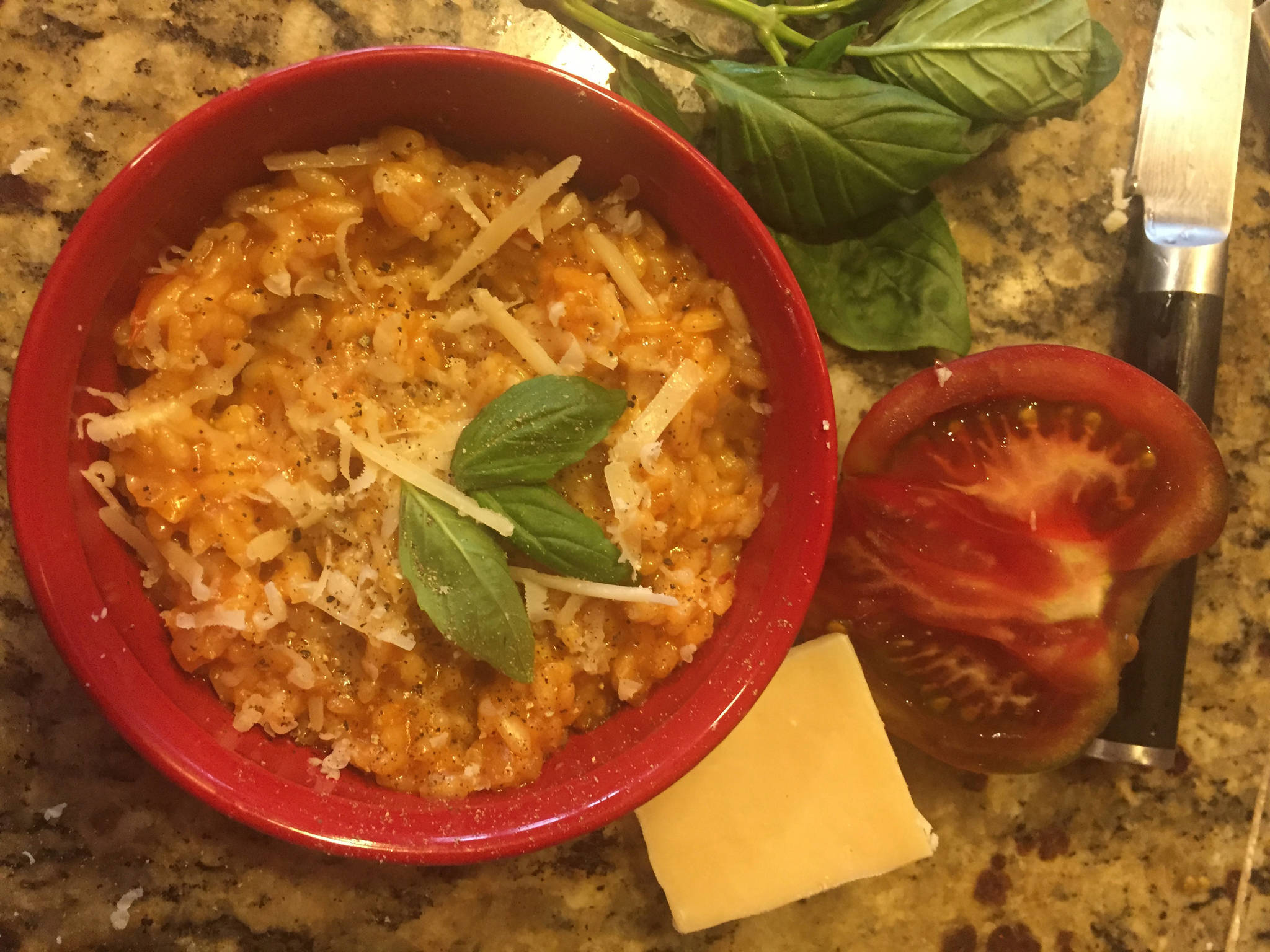 Tomato Risotto takes time to make, but the preparation can be therapeutic. Garnish with snipped basil, as seen here in Teri Robl’s kitchen in this photo taken on Sept. 17, 2019, in Homer, Alaska. (Photo by Teri Robl)