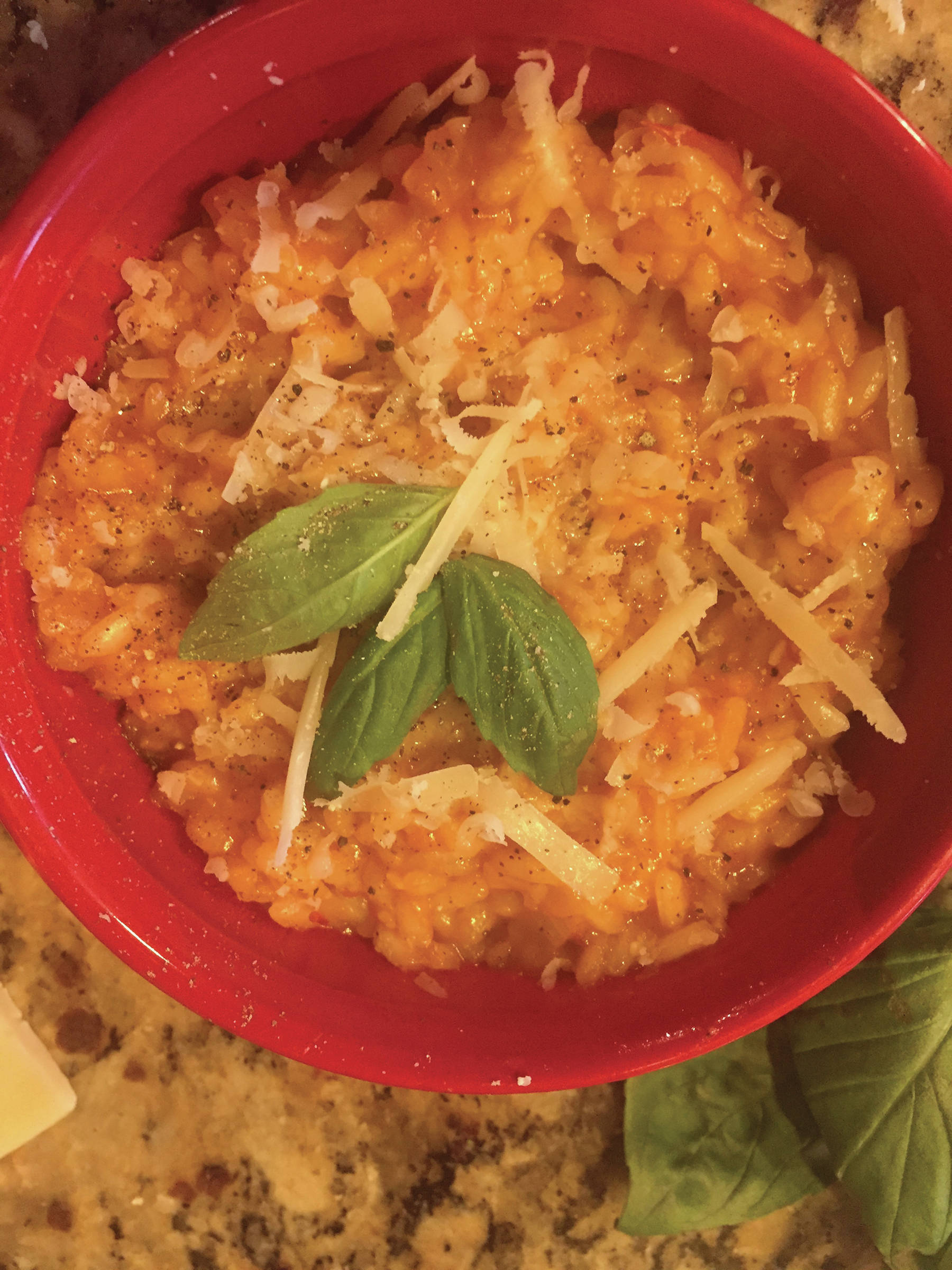 Tomato Risotto takes time to make, but the preparation can be therapeutic. Garnish with snipped basil, as seen here in Teri Robl’s kitchen in this photo taken on Sept. 17, 2019, in Homer, Alaska. (Photo by Teri Robl)