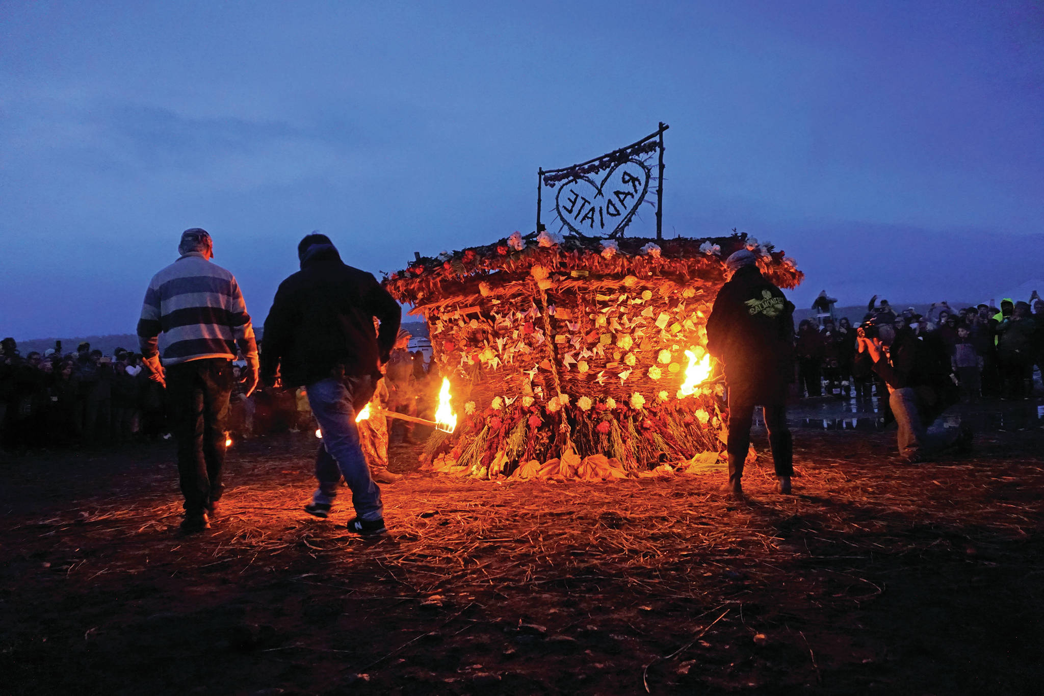Torch bearers prepare to ignite”Radiate,” the 16th annual Burning Basket, on Sunday night, Sept. 15, 2019, at Mariner Park on the Homer Spit in Homer, Alaska. (Photo by Michael Armstrong/Homer News)