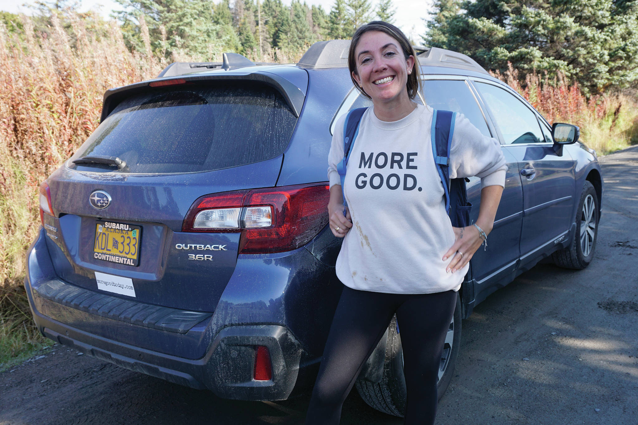 Mary Latham stands by her borrowed blue Subaru Outback on Sept. 16, 2019, in Homer, Alaska. Latham has been touring the United States collecting stories of human kindness to put in a book for people to read in hospital waiting rooms. Alaska is the 48th state Latham has visited since starting her trip in September 2016. (Photo by Michael Armstrong/Homer News)