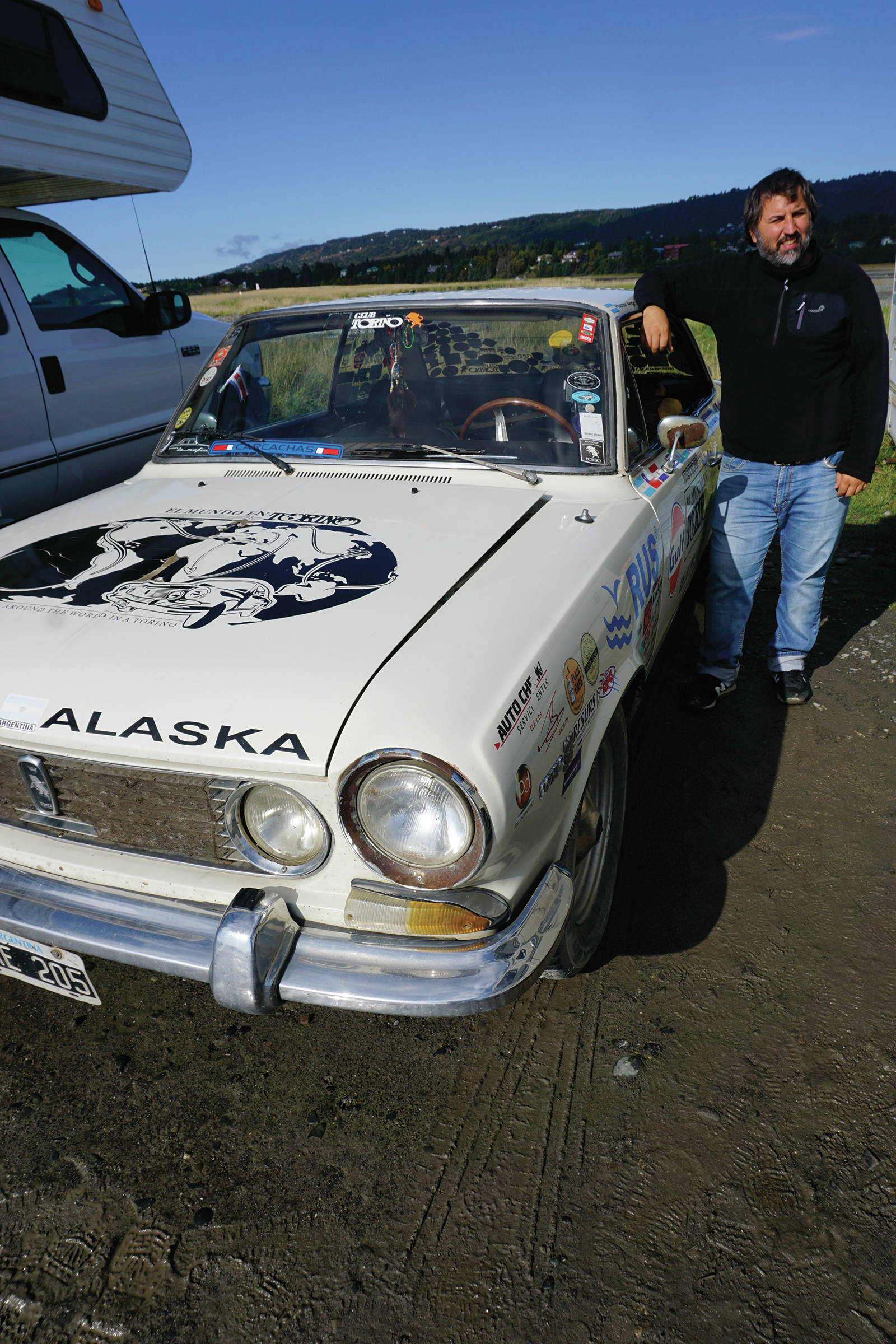 Just a little drive Héctor Argiró stands by his 1969 Torino at on Tuesday, Sept. 16, 2019, at Mariner Park on the Homer Spit in Homer, Alaska. Starting on Nov. 24, 2016, Argiró drove the Argentinian classic car from Buenos Aires to Ushuaia, Argentina, and north to Alaska through South America, Central America, Mexico, the western United States, and Canada. He plans to continue his trip through North America and then to Europe. For more about El Mundo en Torino (“Around the world in a Torino”), visit www.elmundoentorino.com. (Photo by Michael Armstrong/Homer News)