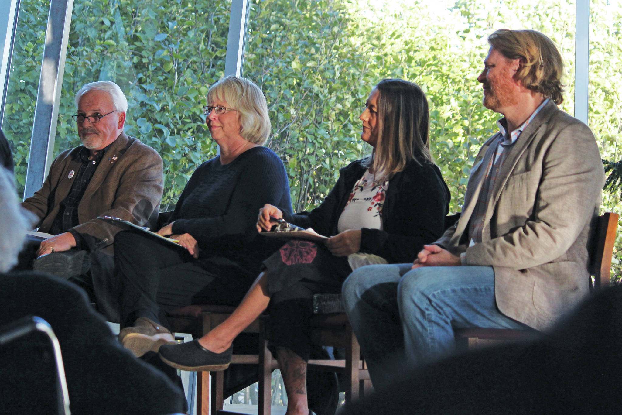From left to right: Candidates for Homer City Council Tom Stroozas, Shelly Erickson, Storm Hansen-Cavasos and Joey Evensen participate in a candidate forum Wednesday, Sept. 25, 2019 at the Homer Public Library in Homer, Alaska. (Photo by Megan Pacer/Homer News)
