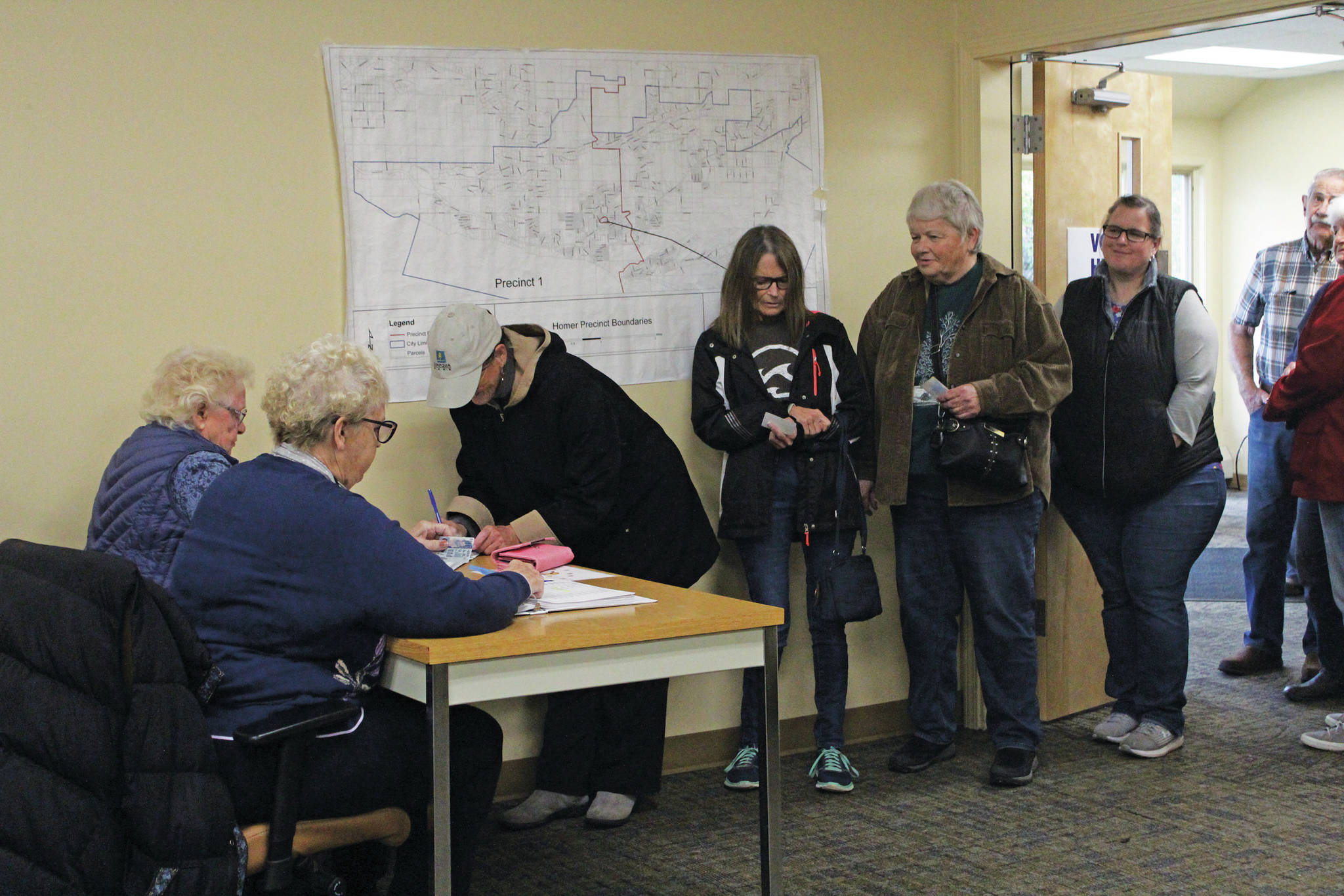 Homer city residents line up to cast their votes in the Tuesday, Oct. 1, 2019 municipal election at Homer City Hall in Homer, Alaska. (Photo by Megan Pacer/Homer News)