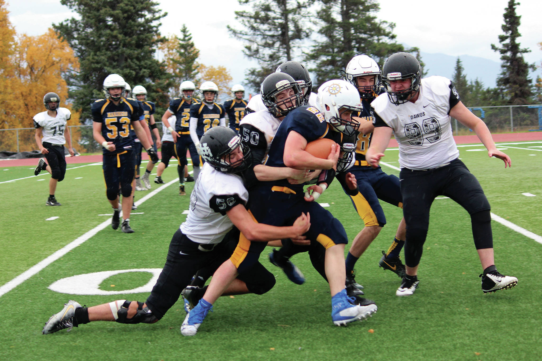 Photo by Megan Pacer/Homer News                                 Homer’s Antonin Maruchev powers through a group of Nikiski defenders during a Saturday, Sept. 28 football game at Homer High School in Homer.