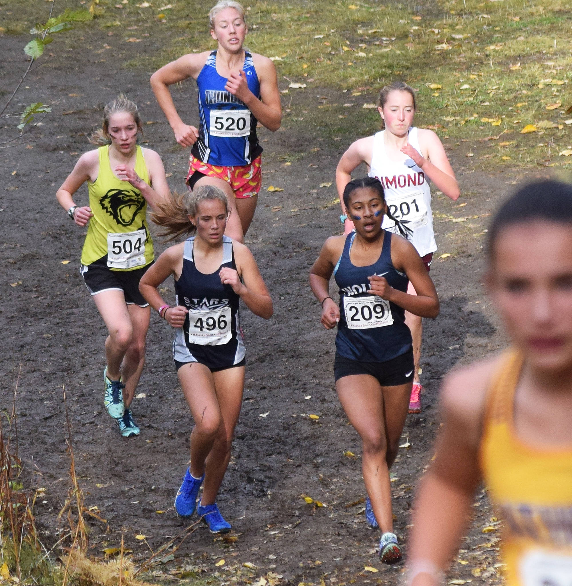 Soldotna’s Jordan Strausbaugh (496) races in a group at the Div. I girls state cross-country championships Saturday, Oct. 5, 2019, on the Bartlett High trails in Anchorage, Alaska. (Photo by Joey Klecka/Peninsula Clarion)