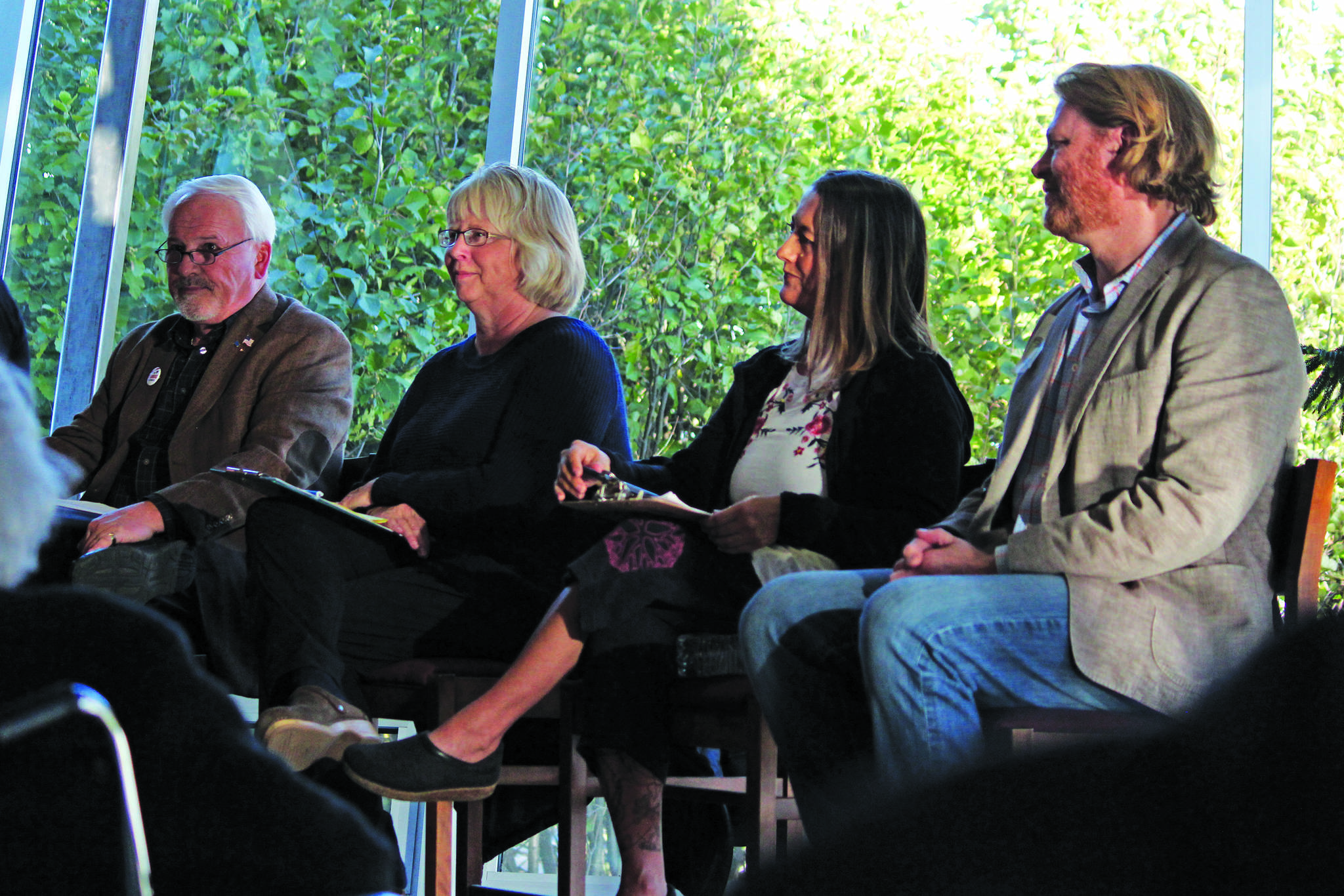 From left to right: Candidates for Homer City Council Tom Stroozas, Shelly Erickson, Storm Hansen-Cavasos and Joey Evensen participate in a candidate forum Wednesday, Sept. 25, 2019 at the Homer Public Library in Homer, Alaska. (Photo by Megan Pacer/Homer News)
