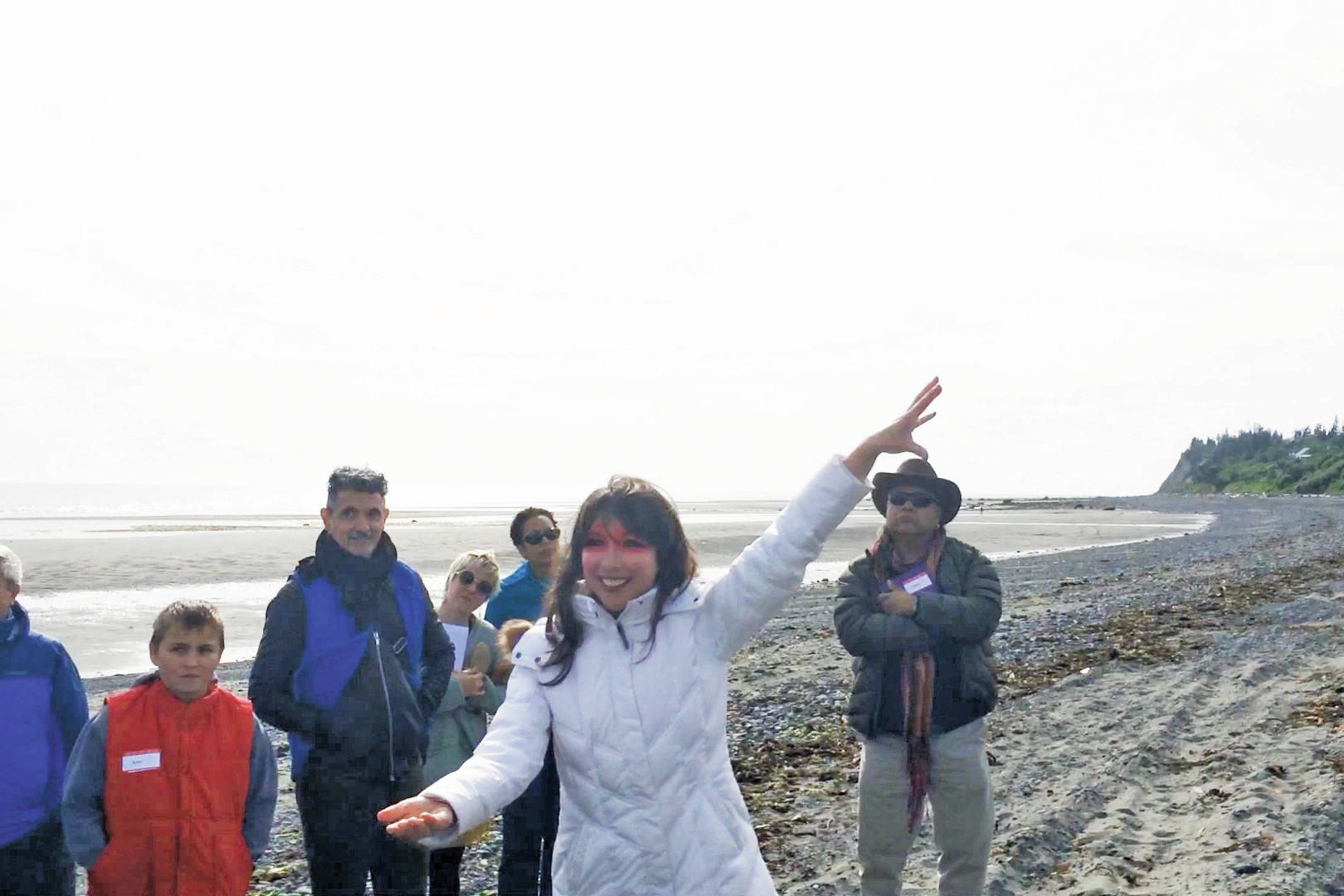 Emily Johnson conducts a land acknowledgment of Bishop’s Beach as Tuggeght, the Dena’ina word for “beluga,” at the art event, SHORE: Tuggeght, on Nov. 7, 2018, in Homer, Alaska. (Photo provided)