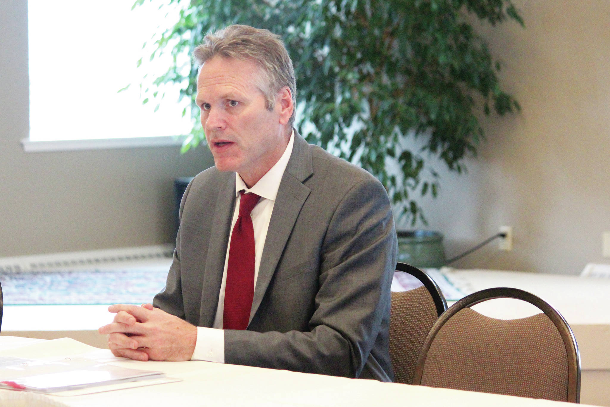 Gov. Mike Dunleavy speaks to attendees of a conference held by the Alaska State Home Building Association and the Kenai Peninsula Home Builders Association on Thursday, Oct. 17, 2019 at Land’s End Resort in Homer, Alaska. Dunleavy came to brief conference participants on the statewide economy. (Photo by Megan Pacer/Homer News)