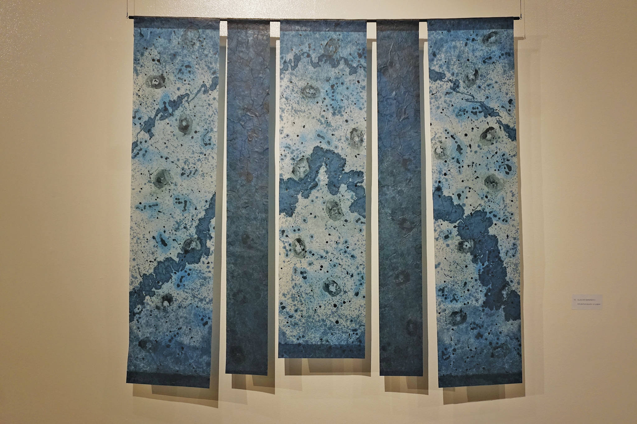 Kathy Smith’s “Glacier Banner 3,” a painting in her exhibit, “Rivers of Ice,” showing at the Pratt Museum through Dec. 28. 2019, in Homer, Alaska. (Photo by Michael Armstrong/Homer News)