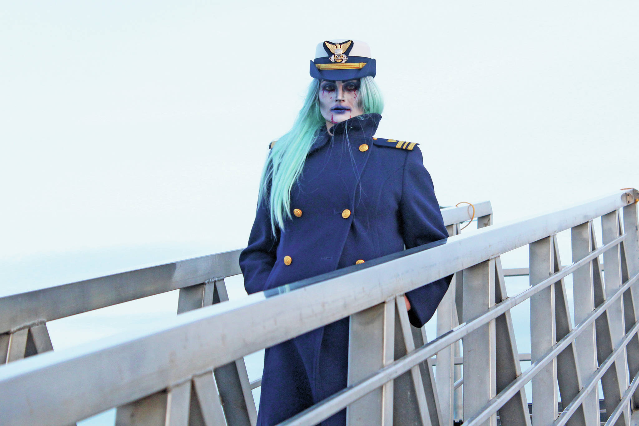 Lt. Cmdr. Jeannette Greene, captain of the US Coast Guard Cutter Hickory, prepares to greet guests at this year’s Haunted Hickory event Friday, Oct. 25, 2019 at the harbor in Homer, Alaska. Each year the crew of the Hickory transform the vessel into a haunted house for the community and collect food items as admission, all of which is given to the Homer Food Pantry. (Photo by Megan Pacer/Homer News)