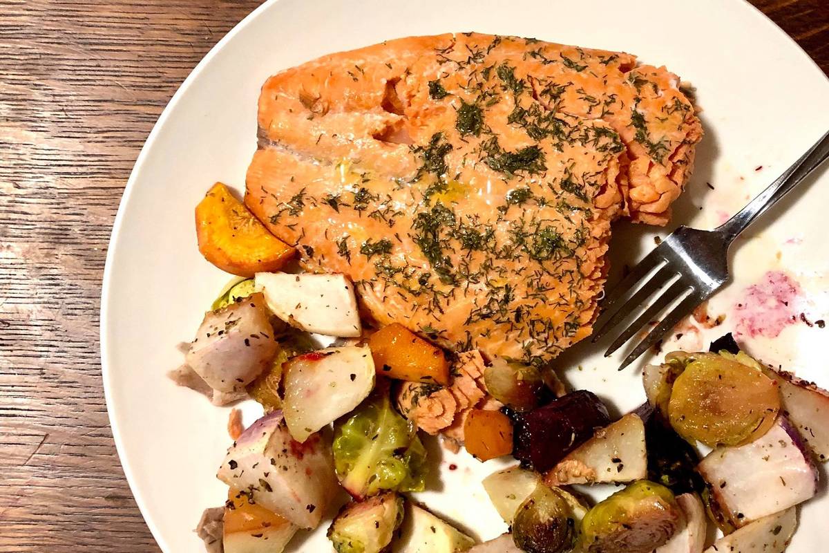 Baked salmon with roasted turnips, brussell sprouts, carrots, beets, kohlrabi for dinner, Wednesday, Oct. 22, 2019, near Kenai, Alaska. (Photo by Victoria Petersen/Peninsula Clarion)