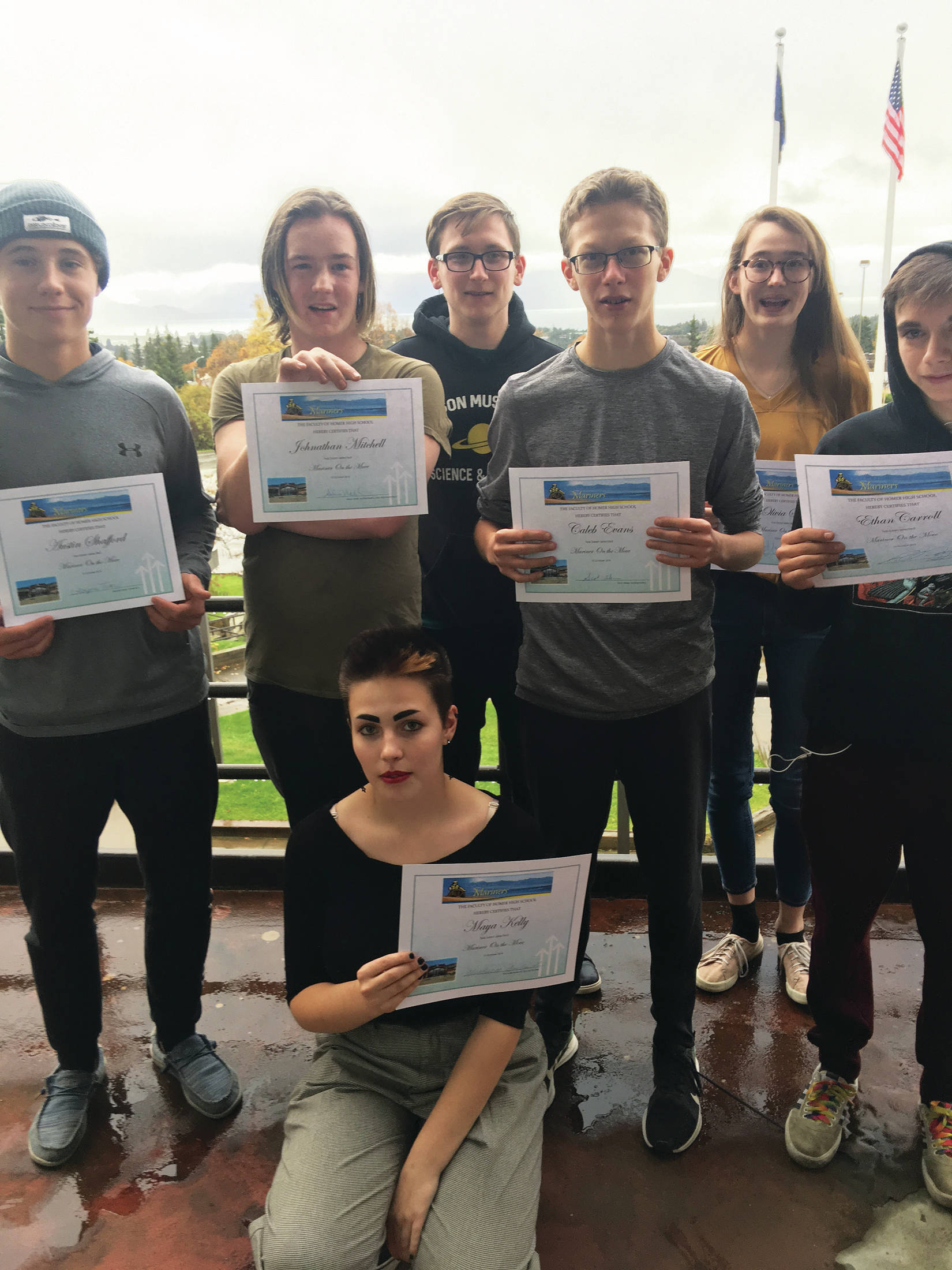 From left to right: Austin Shafford, Johnathan Mitchell, Maya Kelly, Anthony Melkomukov, Caleb Evans, Olivia Smith and Ethan Carroll, shown in this undated photo at Homer High School in Homer, Alaska, are the most recent recipients of the Mariners on the Move award. (Photo courtesy Paul Story)