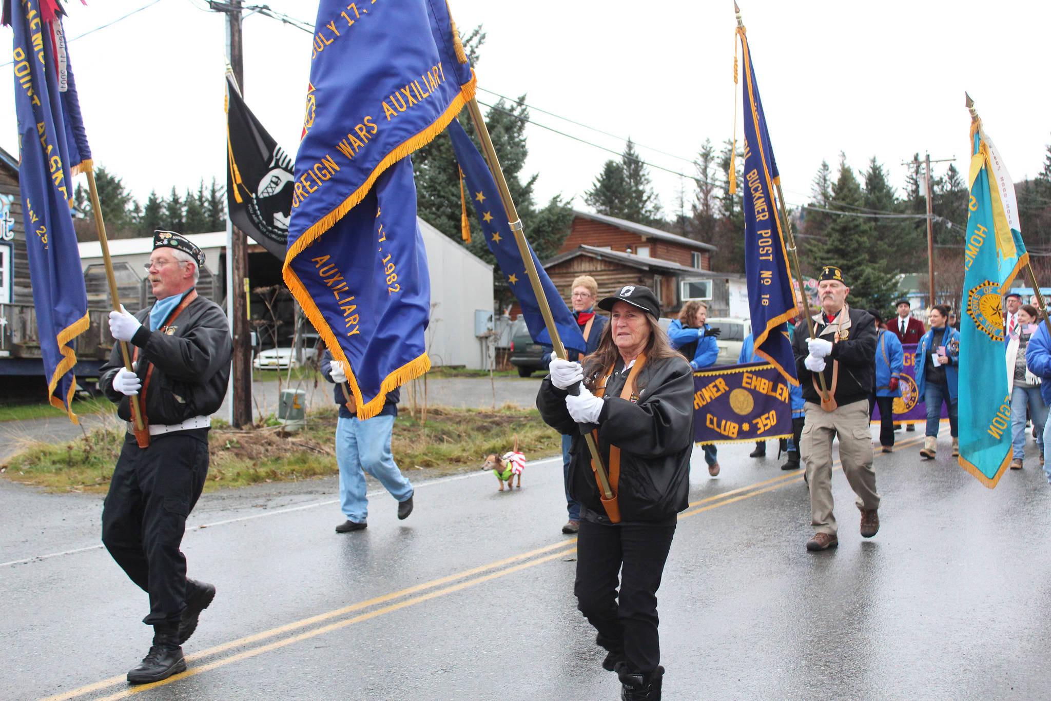 (Photo by Megan Pacer/Homer News) Veterans march down Main Street in a Veterans Day parade Sunday, Nov. 11, 2018 in Homer, Alaska. Veterans Day events start at 11 a.m. Monday, Nov. 11, at the memorial at the corner of Lake Street and Pioneer Avenue. After a parade down Pioneer Avenue and ending on the Sterling Highway, a second ceremony will be held at the Veterans Memorial at the Alaska Islands and Ocean Visitor Center.