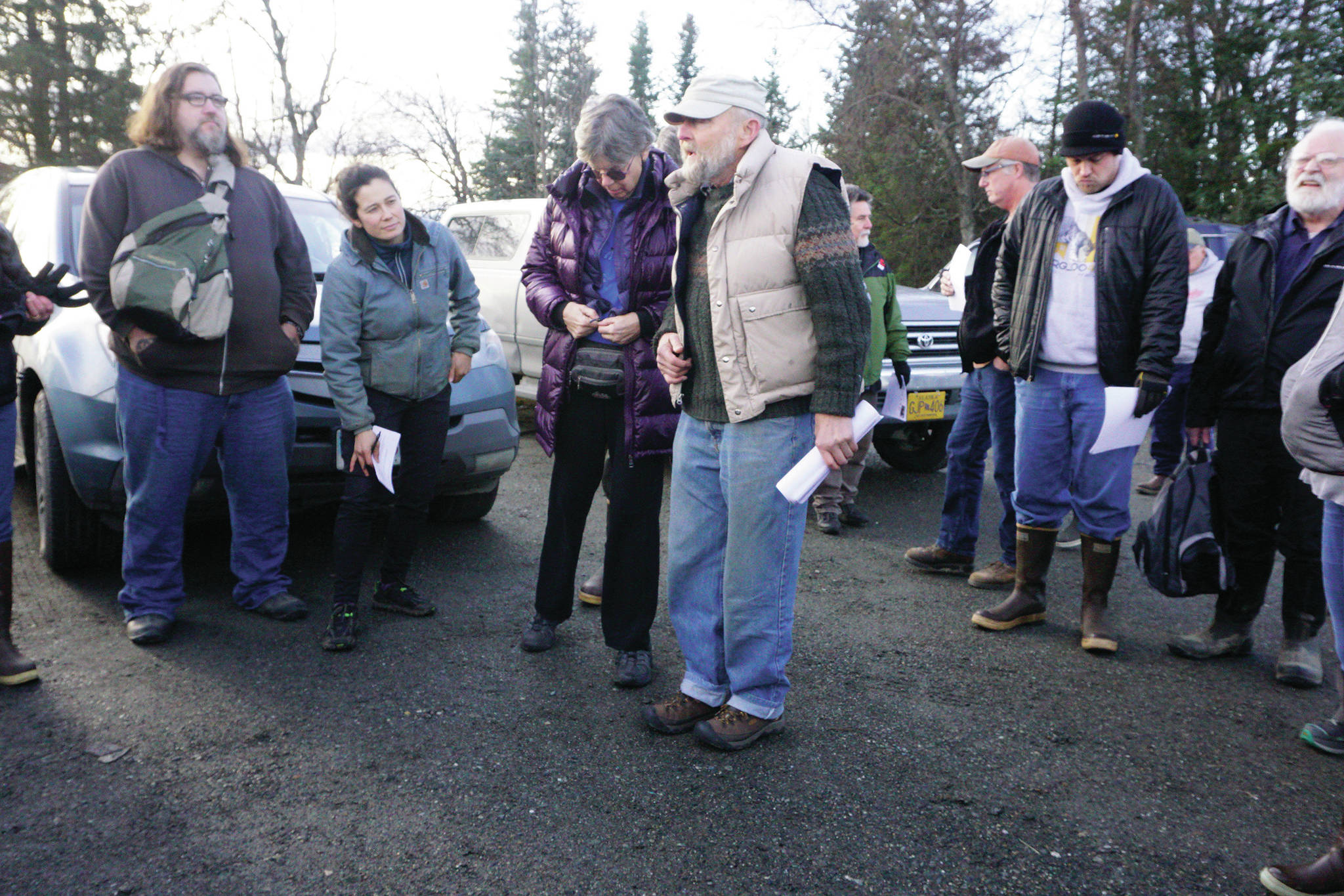 Photo by Michael Armstrong/Homer News                                 Ed Berg, center, briefs a volunteers on a plan to canvass the East End Road neighborhood in a search for his stepdaughter, Anesha “Duffy” Murnane, on Nov. 10 at the Homestead Restaurant parking lot in Fritz Creek. Sara Berg, Anesha’s mother, listens to Berg’s right.