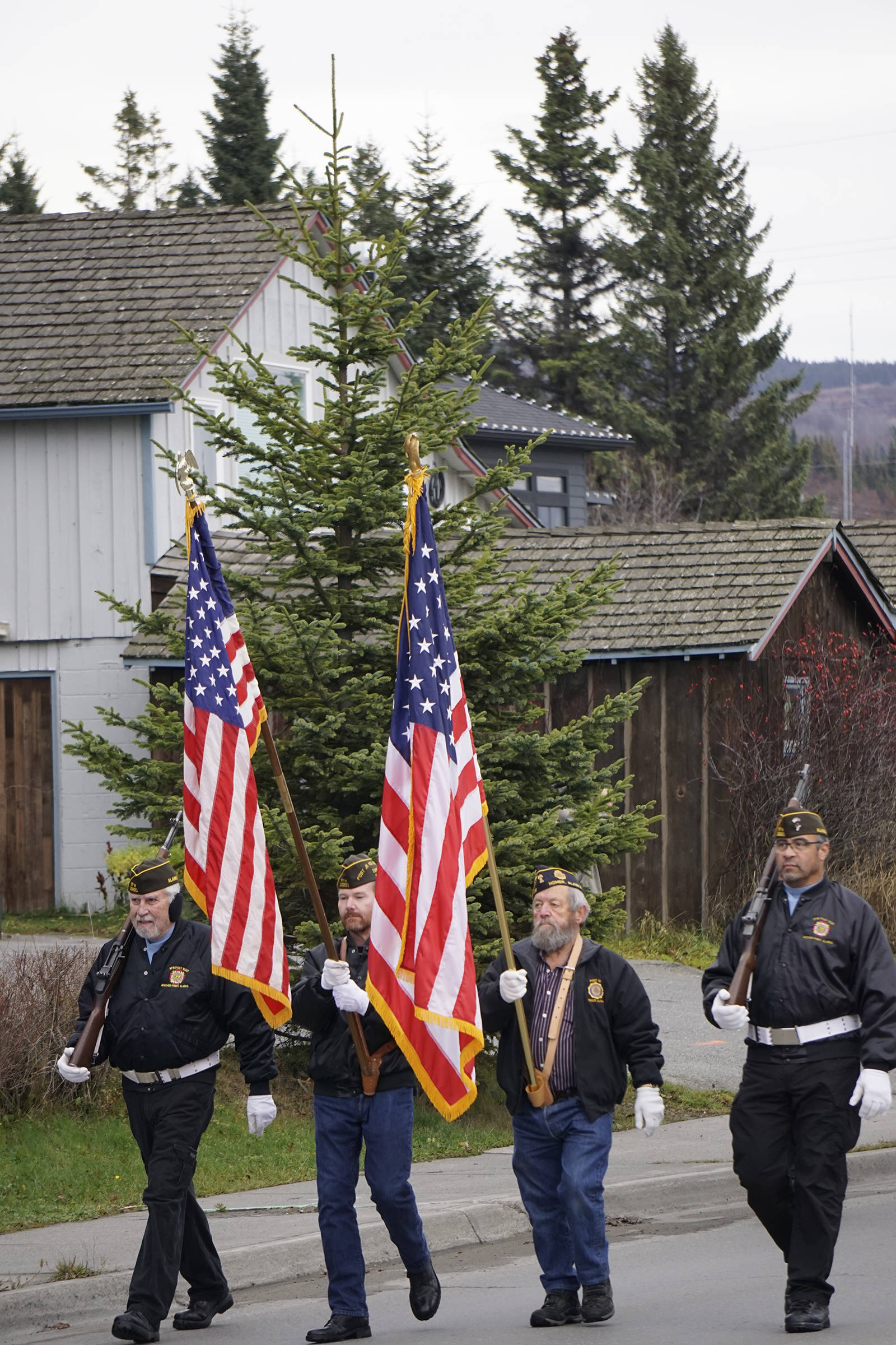 Members of the Veterans of Foreign Wars, Anchor Point Post, march on Pioneer Avenue in Veterans Day ceremonies on Nov. 11, 2019,in Homer, Alaska. (Photo by Michael Armstrong / Homer News)