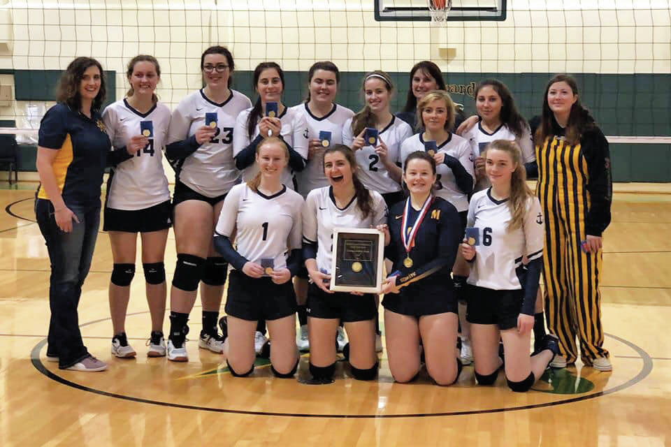 The Homer volleyball team celebrates winning the Southcentral Conference Championships on Saturday, Nov. 9, 2019 in Seward, Alaska. (Photo by Kathy Vogl)
