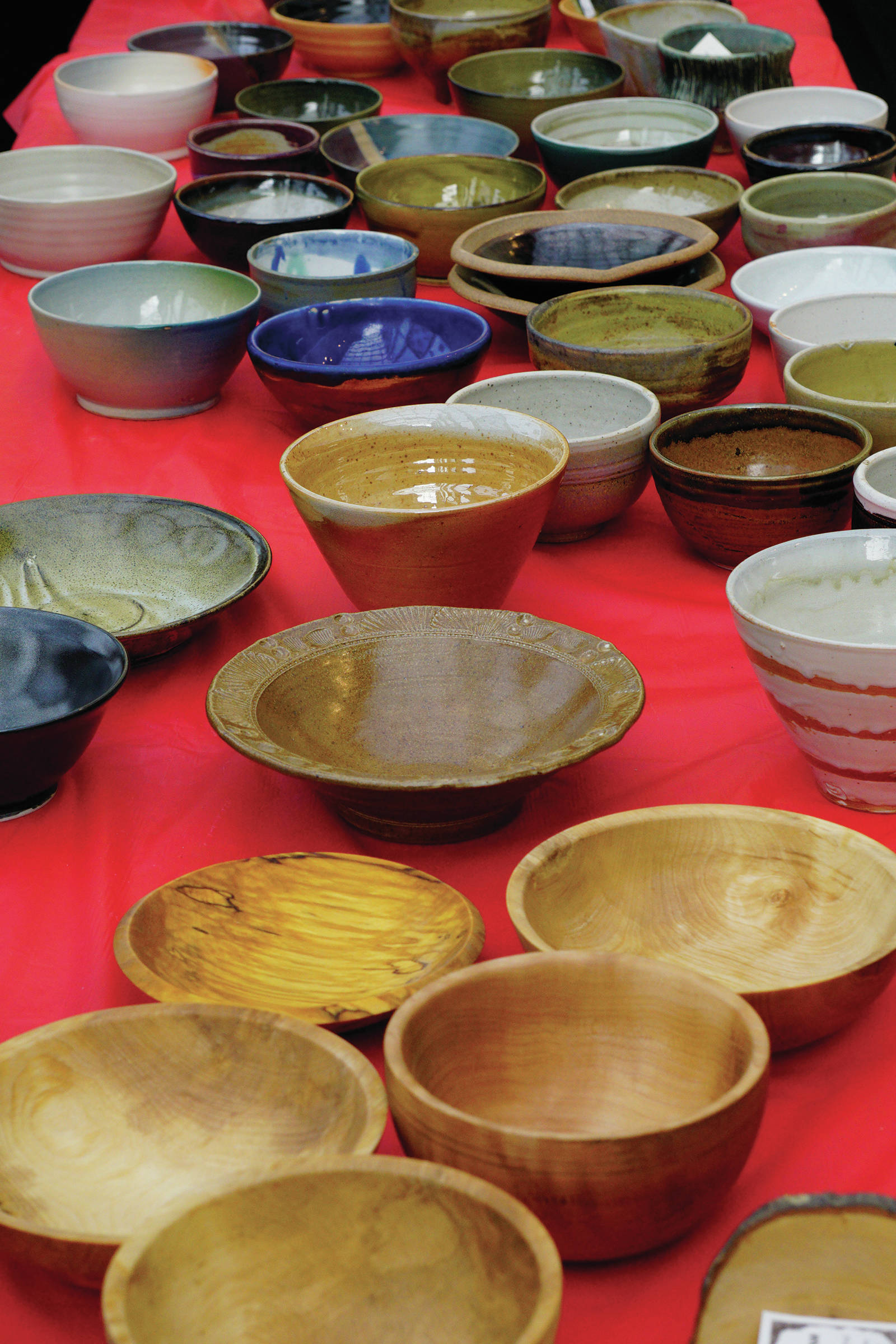 Bowls for sale are displayed at the annual Homer Community Food Pantry’s Empty Bowls fundraiser on Friday, Nov. 8, 2019, at Homer United Methodist Church in Homer, Alaska. People could purchase just soup or, for $35, buy a handcrafted ceramic or wooden bowl with their soup. (Photo by Michael Armstrong/Homer News)