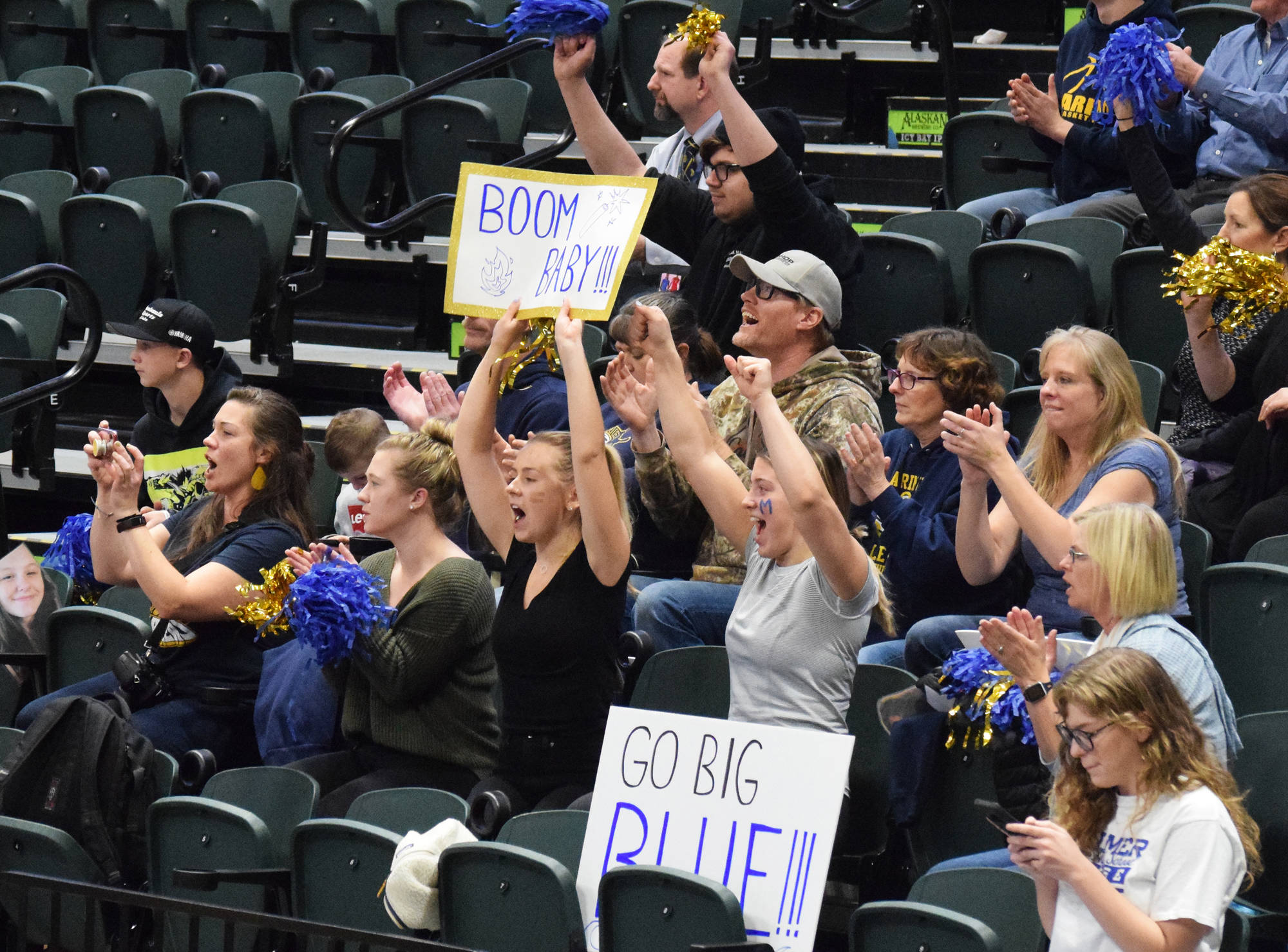 Homer fans cheer on the Mariners Saturday, Nov. 16, 2019, against Kenai Central at the Class 3A state volleyball tournament at the Alaska Airlines Center in Anchorage, Alaska. (Photo by Joey Klecka/Peninsula Clarion)