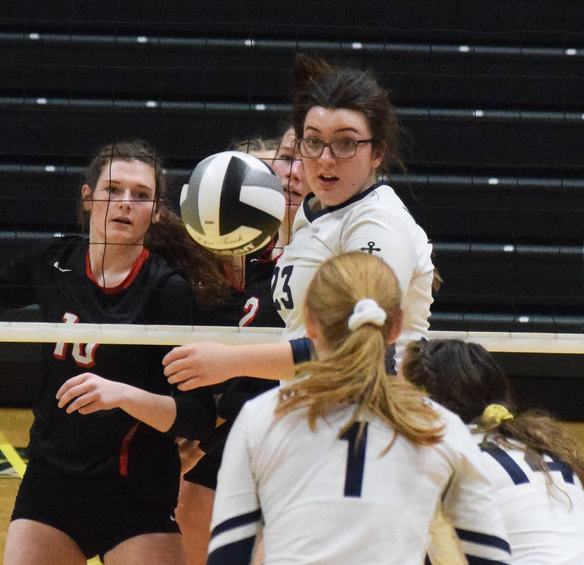 Homer’s Tonda Smude looks back at the ball Saturday, Nov. 16, 2019, against Kenai Central at the Class 3A state volleyball tournament at the Alaska Airlines Center in Anchorage, Alaska. (Photo by Joey Klecka/Peninsula Clarion)