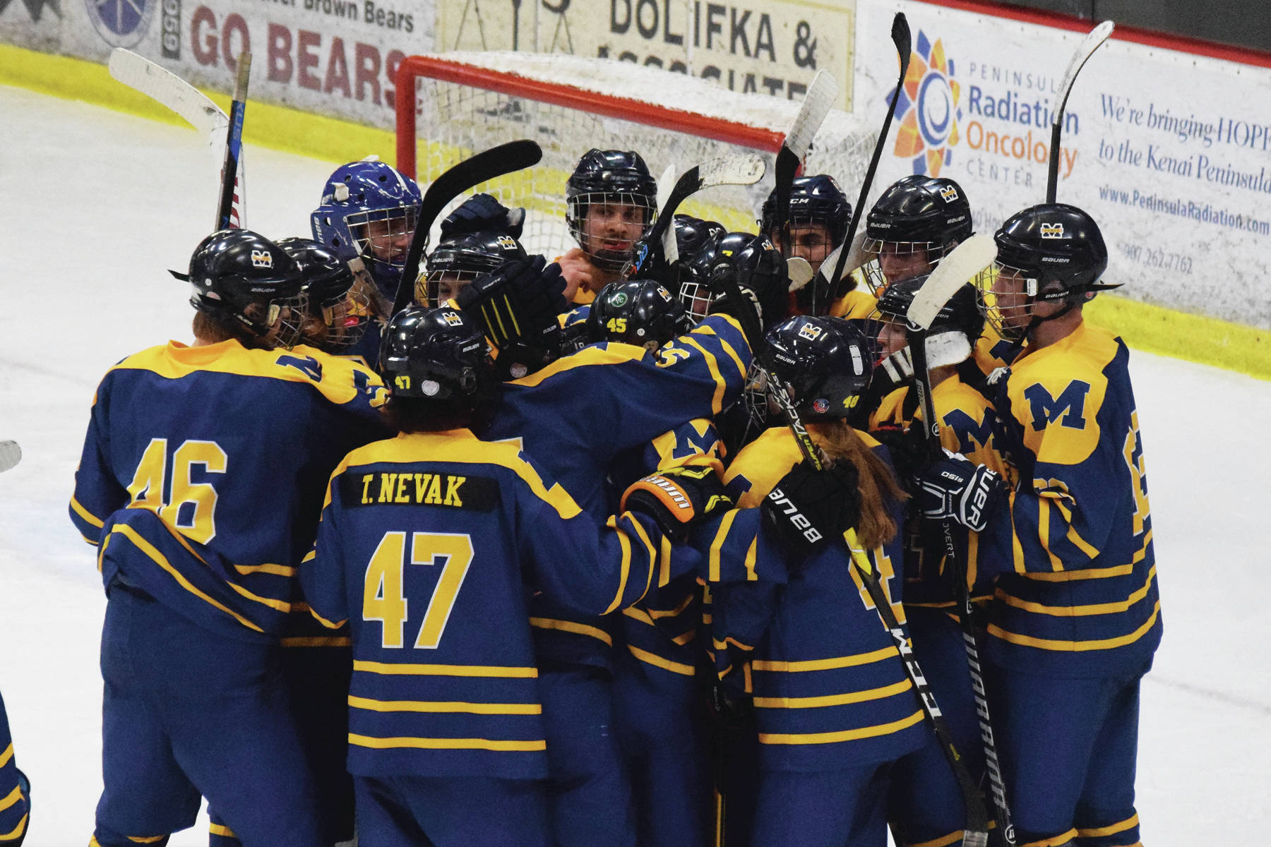 The Homer hockey team celebrates a 4-3 overtime win over Soldotna, Friday, Nov. 22, 2019, at the Soldotna Regional Sports Complex in Soldotna, Alaska. (Photo by Joey Klecka/Peninsula Clarion)