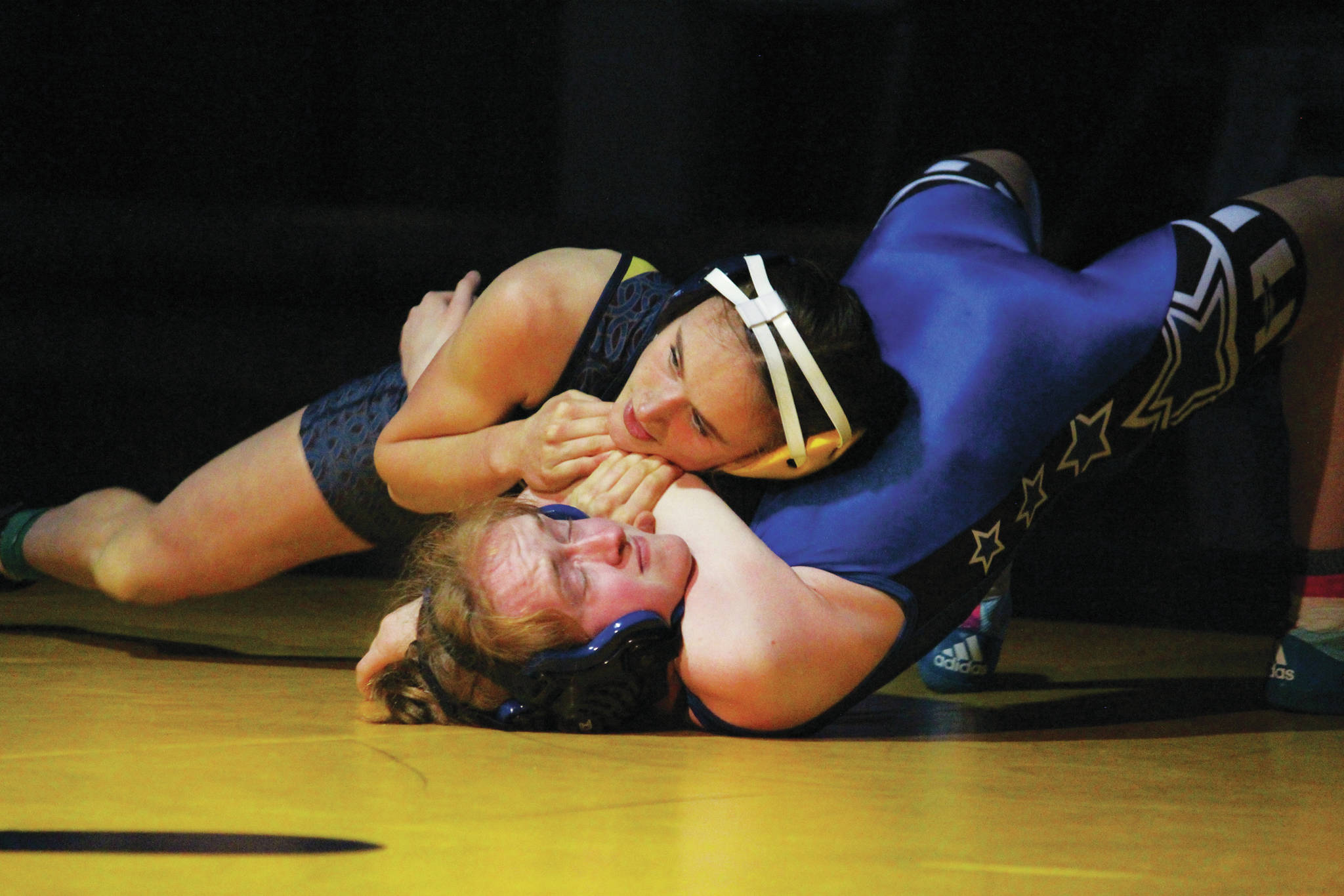 Homer’s Autumn Daigle tries to pin Soldotna’s Tovia Owens during a dual wrestling meet at Homer High School in Homer, Alaska. (Photo by Megan Pacer/Homer News)