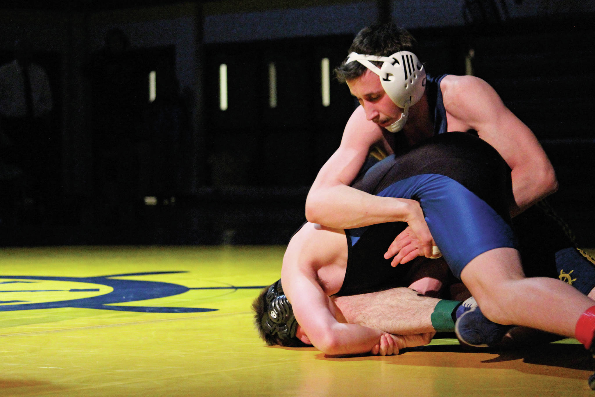 Afony Reutov wrestles with Soldotna’s Zach Burns during a dual wrestling meet between Soldotna and Homer High School on Wednesday, Nov. 27, 2019 at the school in Homer, Alaska. (Photo by Megan Pacer/Homer News)