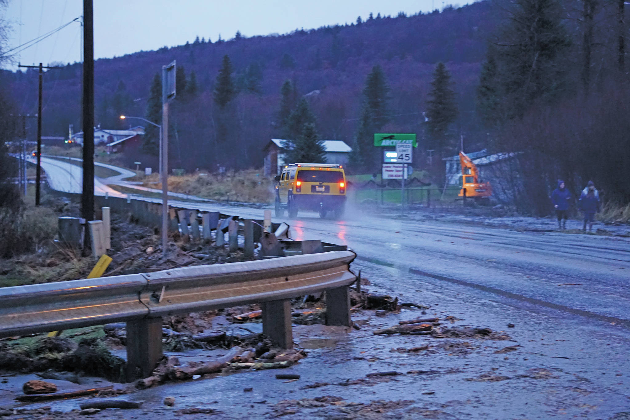 Mud and debris is washed up at Bear Creek near East End Road on Monday afternoon, Dec. 9, 2019, in Homer, Alaska. Bear Creek crosses East End Road near Bear Creek Drive and overflowed the creek banks. (Photo by Michael Armstrong/Homer News)