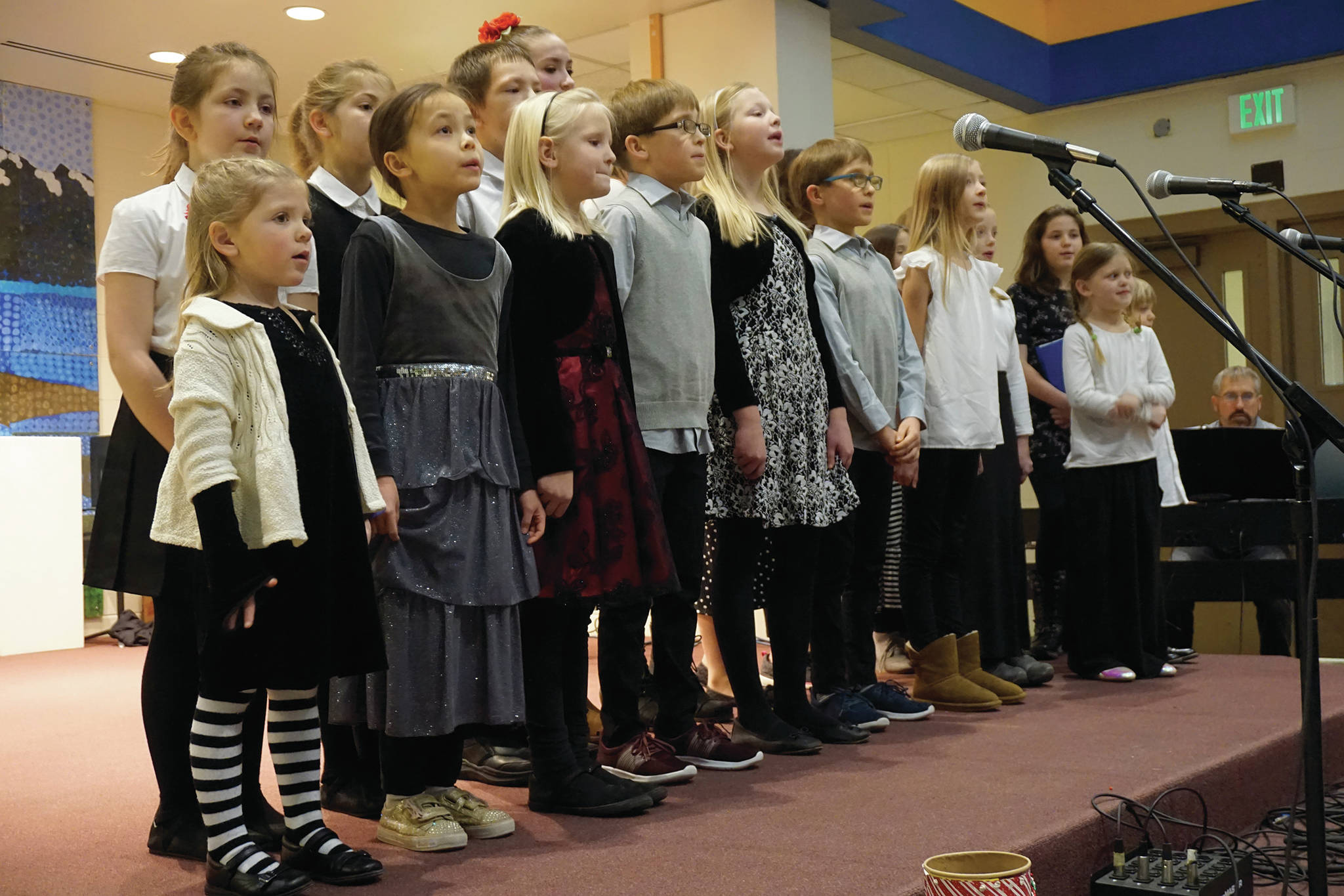Children with the Harbor School of Music sing at the Homer Nutcracker Faire on Sunday, Dec. 8, 2019, at Homer High School in Homer, Alaska. (Photo by Michael Armstrong/Homer News)