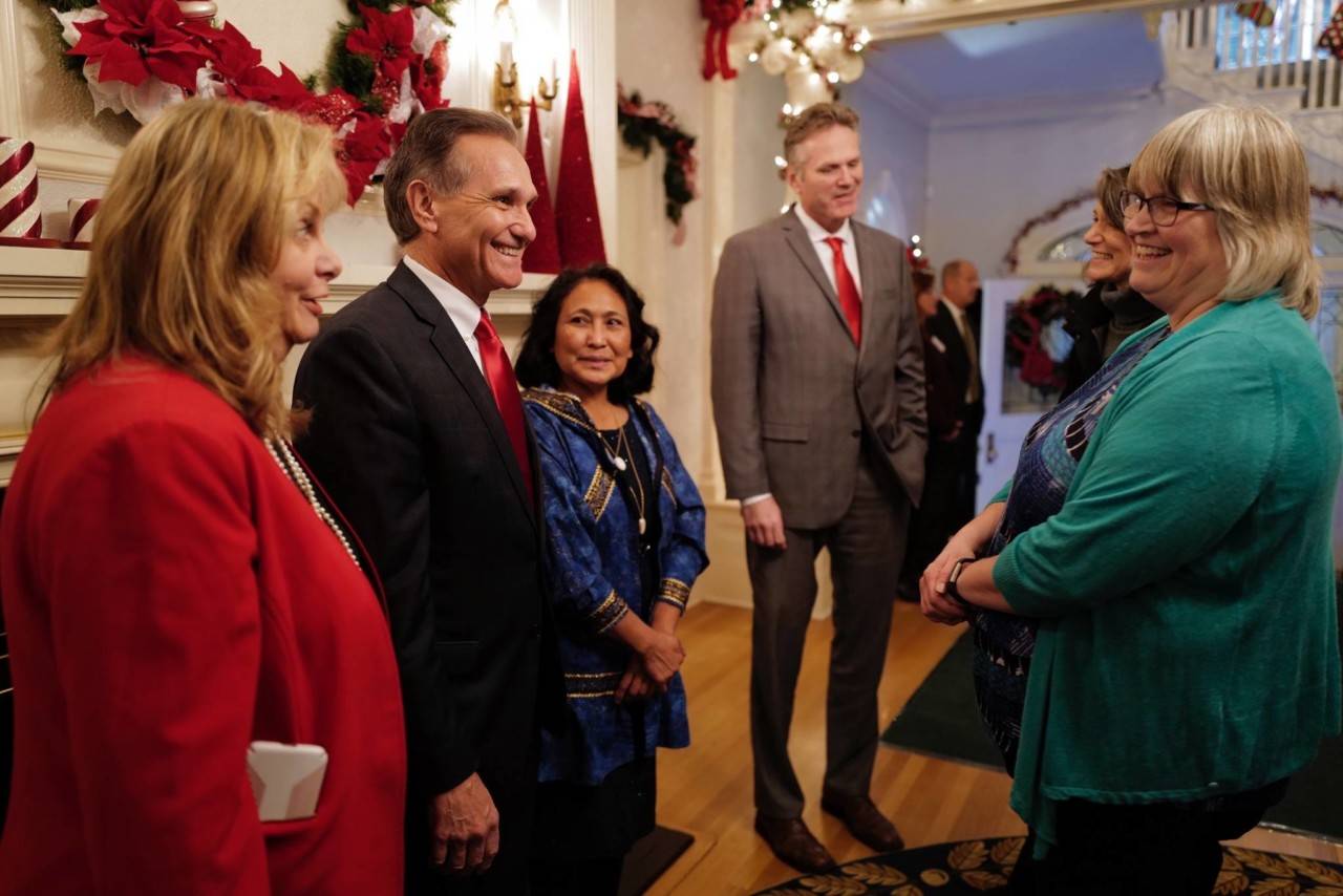 Juneau Mayor Beth Weldon, right, is greeted by Gov. Mike Dunleavy, R-Alaska, and his wife, Rose, Lt. Gov. Kevin Meyer and his wife, Marti, at the Governor’s Open House on Tuesday, Dec. 10, 2019. (Michael Penn | Juneau Empire)