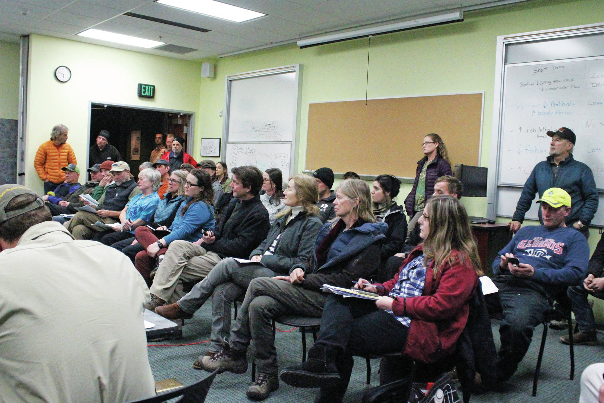 Members of the public wait their turn to give comments at a Kachemak Bay State Parks Citizen Advisory Board meeting Wednesday, Dec. 11, 2019 at the Alaska Islands & Ocean Visitor Center in Homer, Alaska. The board decided to hear comments on the proposal by the Department of Fish and Game to repeal the ban on personal watercraft in critical habitat areas of Kachemak Bay. The state park waters overlap in some places with the critical habitat waters. (Photo buy Megan Pacer/Homer News)