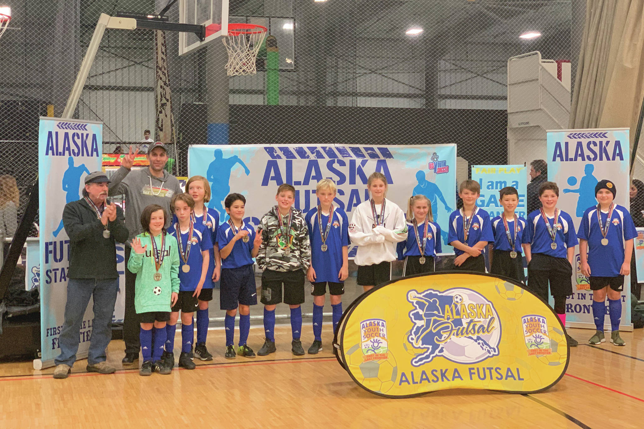 Members of the Defenders, an under 12 boys/girls team with the Soccer Association of Homer, celebrate winning second place at the 2019 Alaska Youth Soccer Futsal State Cup in Anchorage, Alaska. (Photo courtesy Breanna Hill)